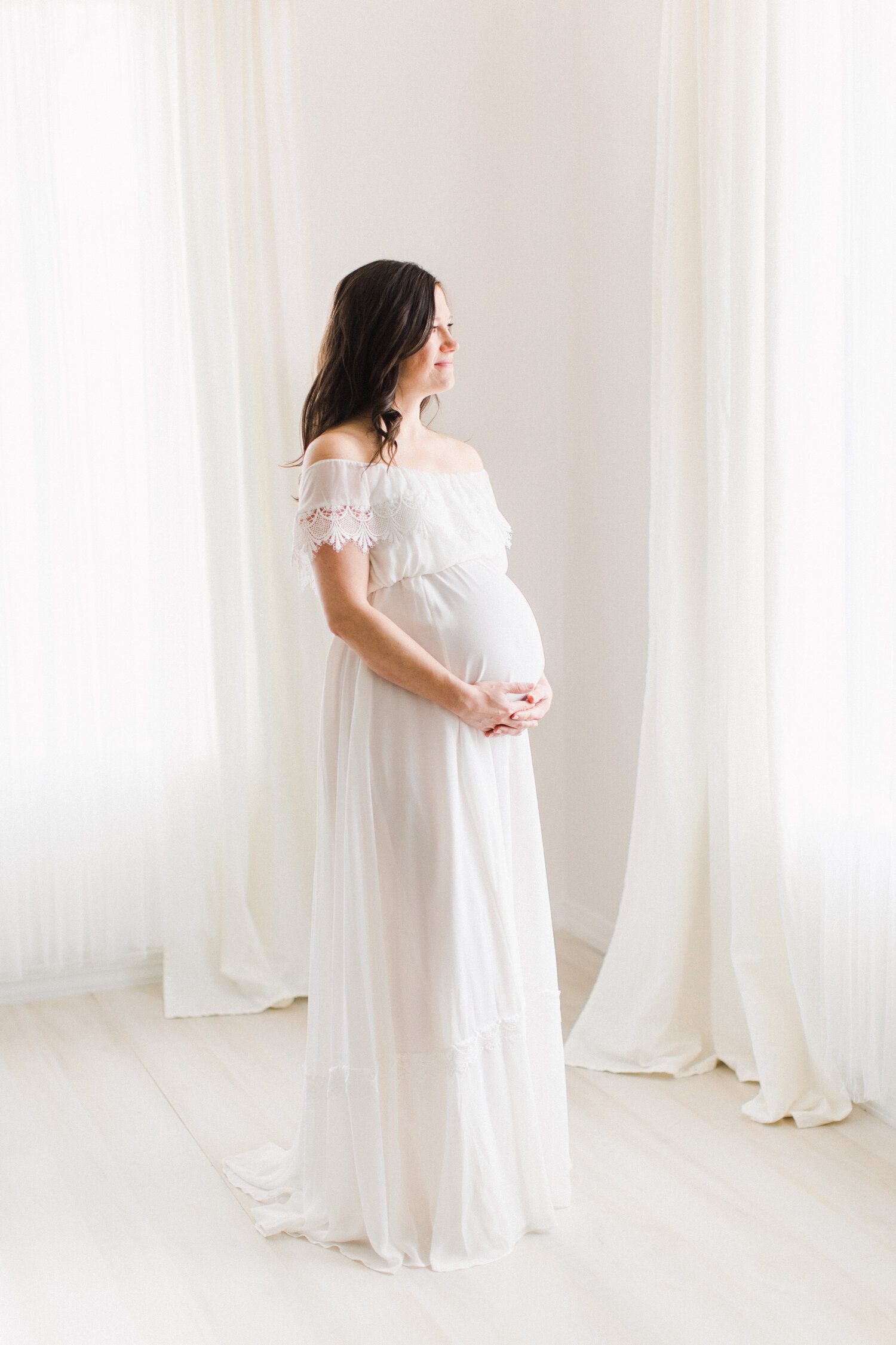 Studio maternity session in BHLDN off the shoulder dress.