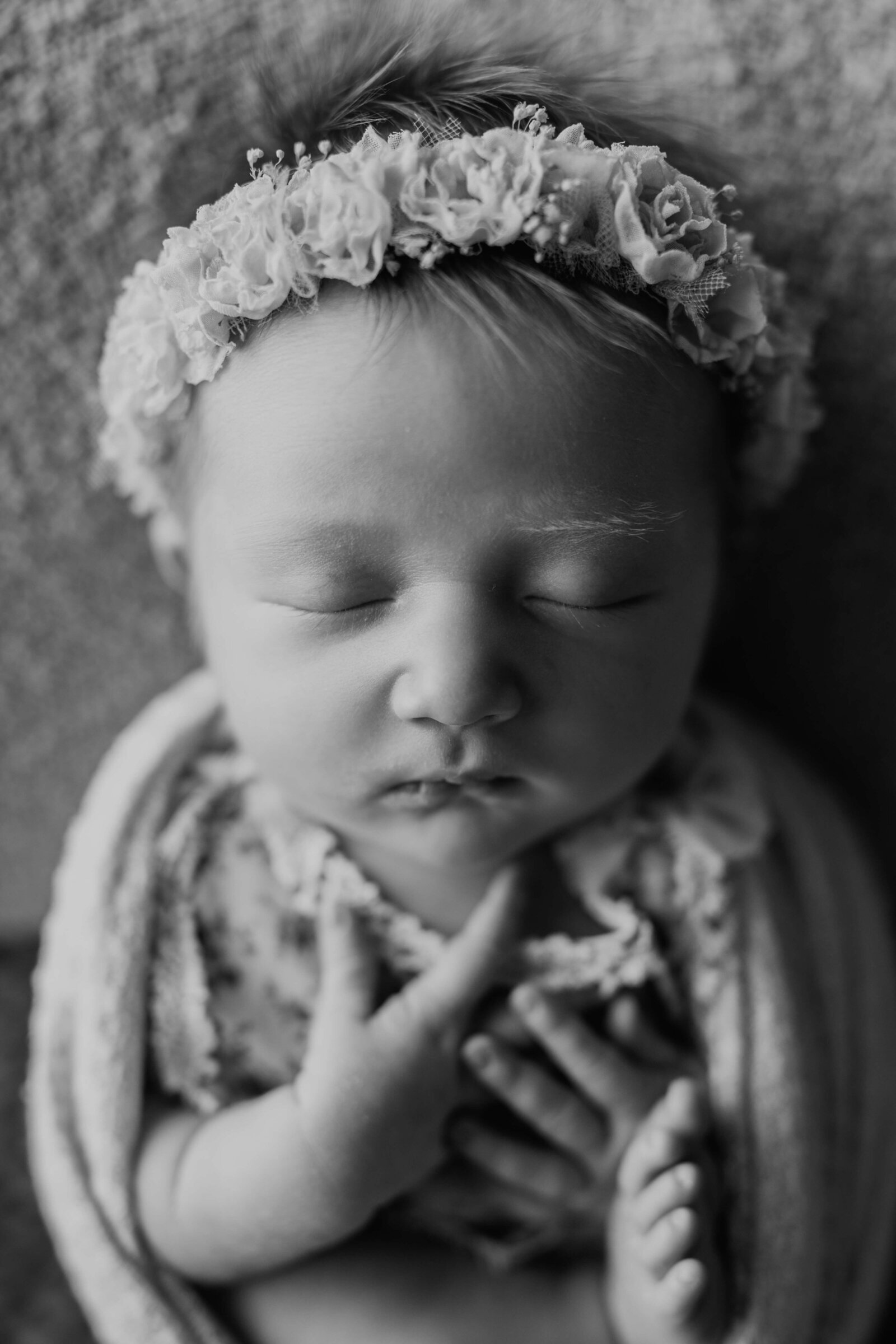 fine art baby girl swaddled with a flower crown