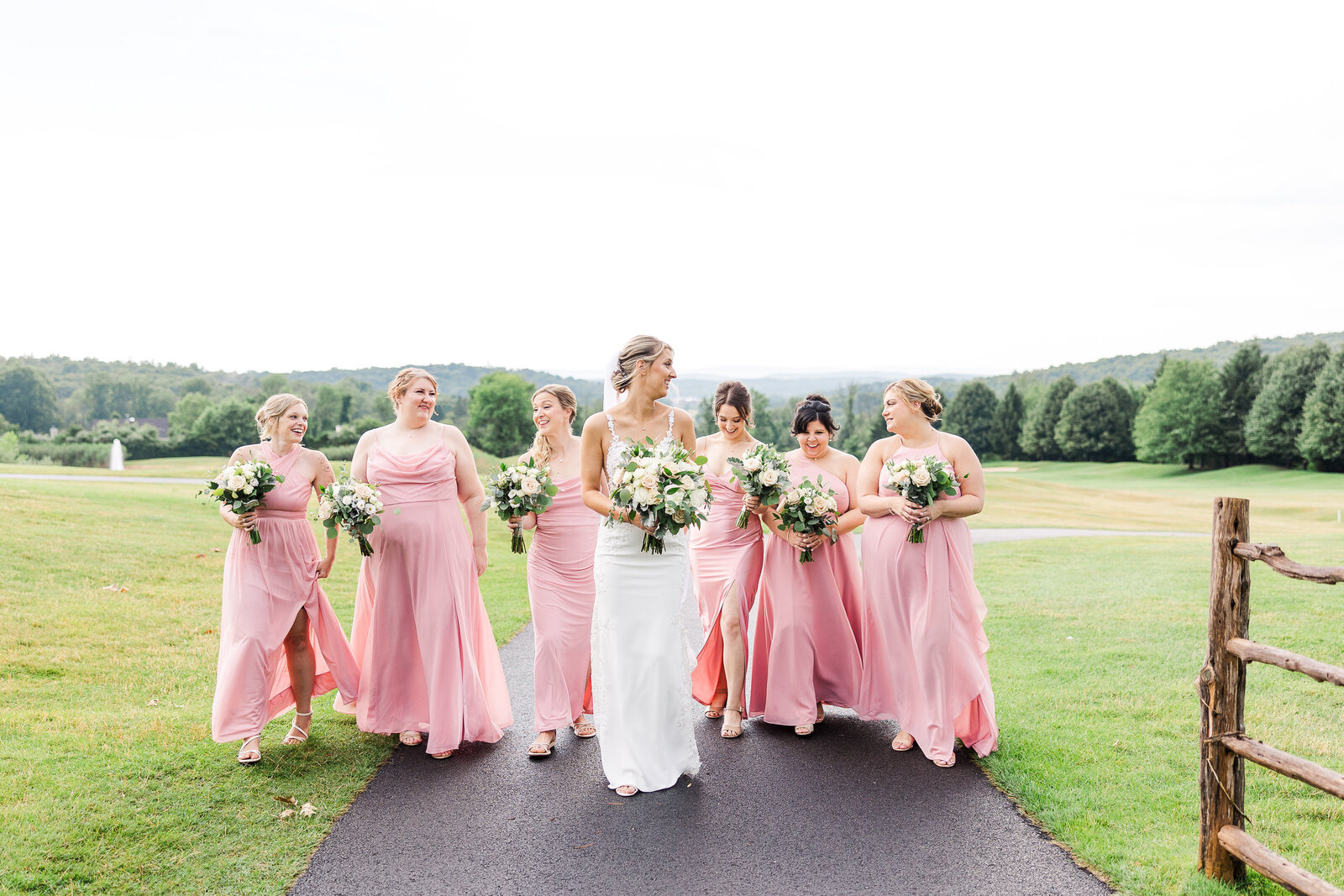 Bridesmaids laughing and walking together at SkyView Golf Club wedding