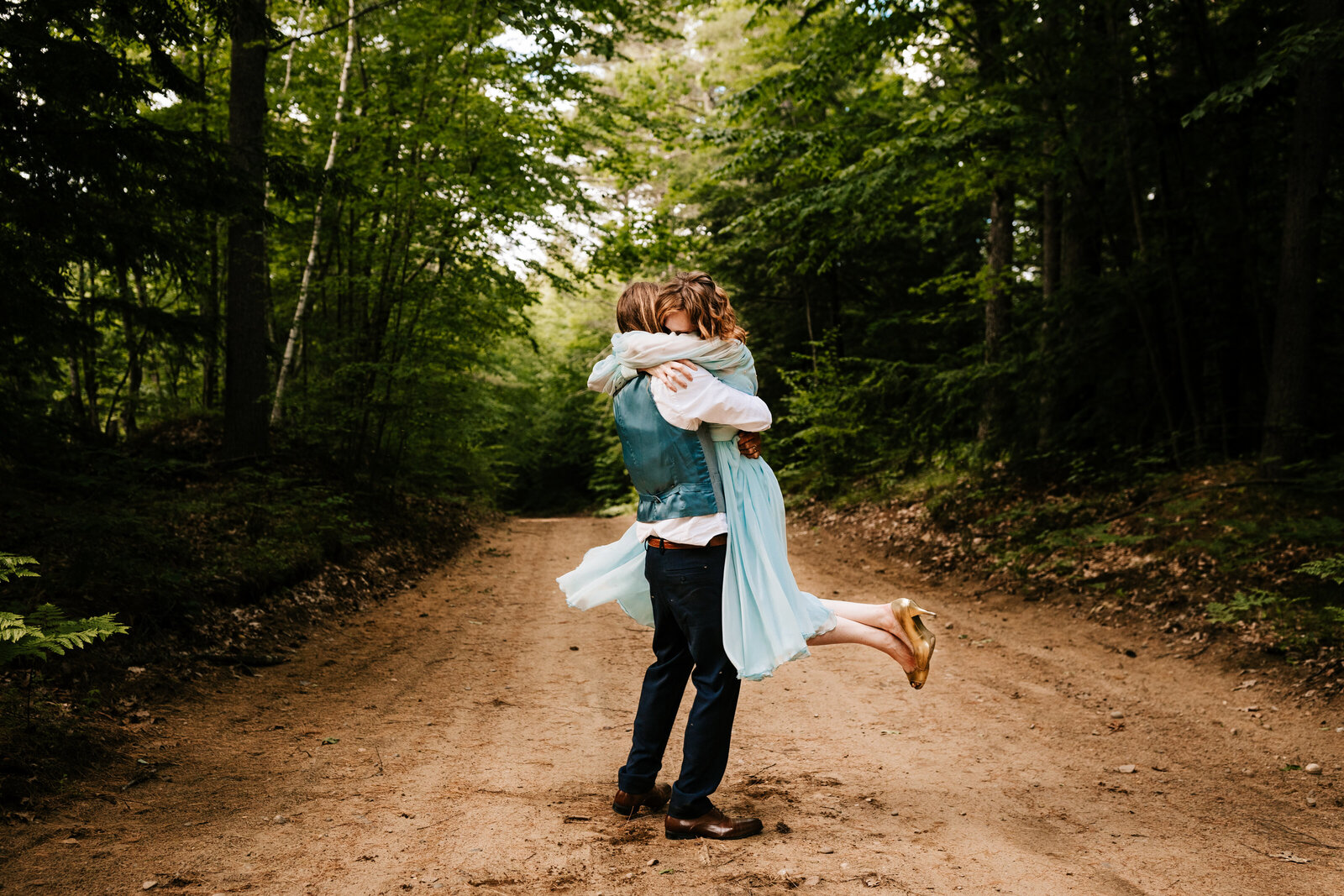 A photo of a bride and groom embracing during their elopement in New Hampshire