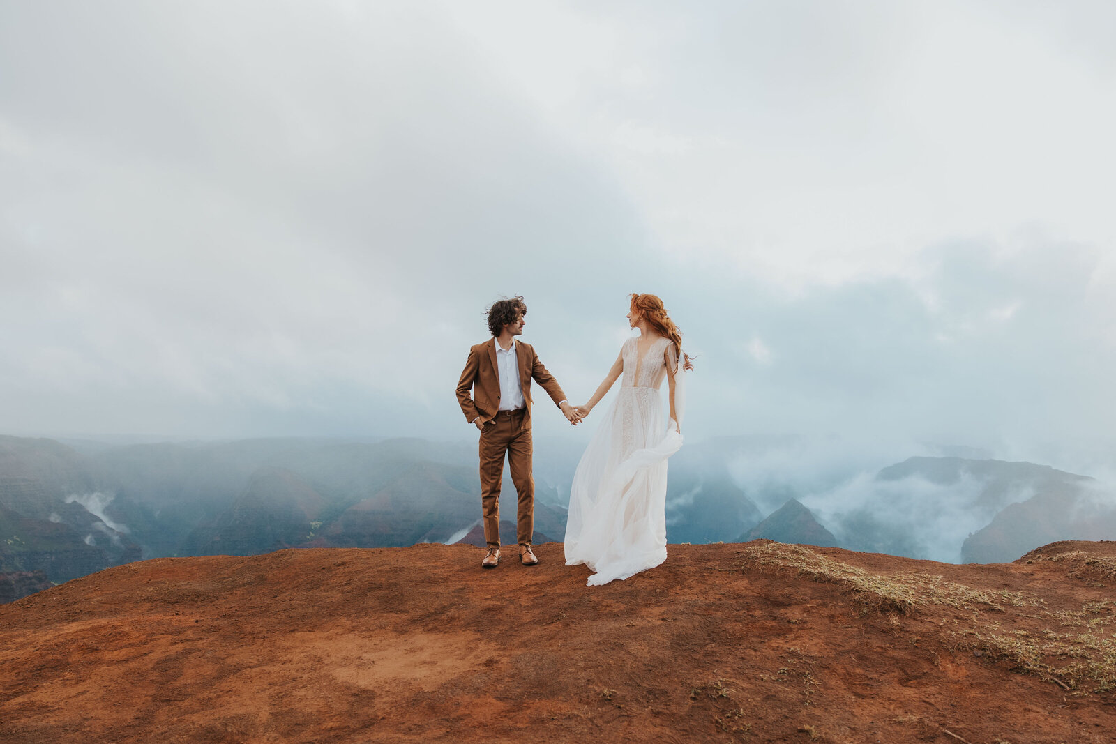 couple eloping on a hidden beach in kauai