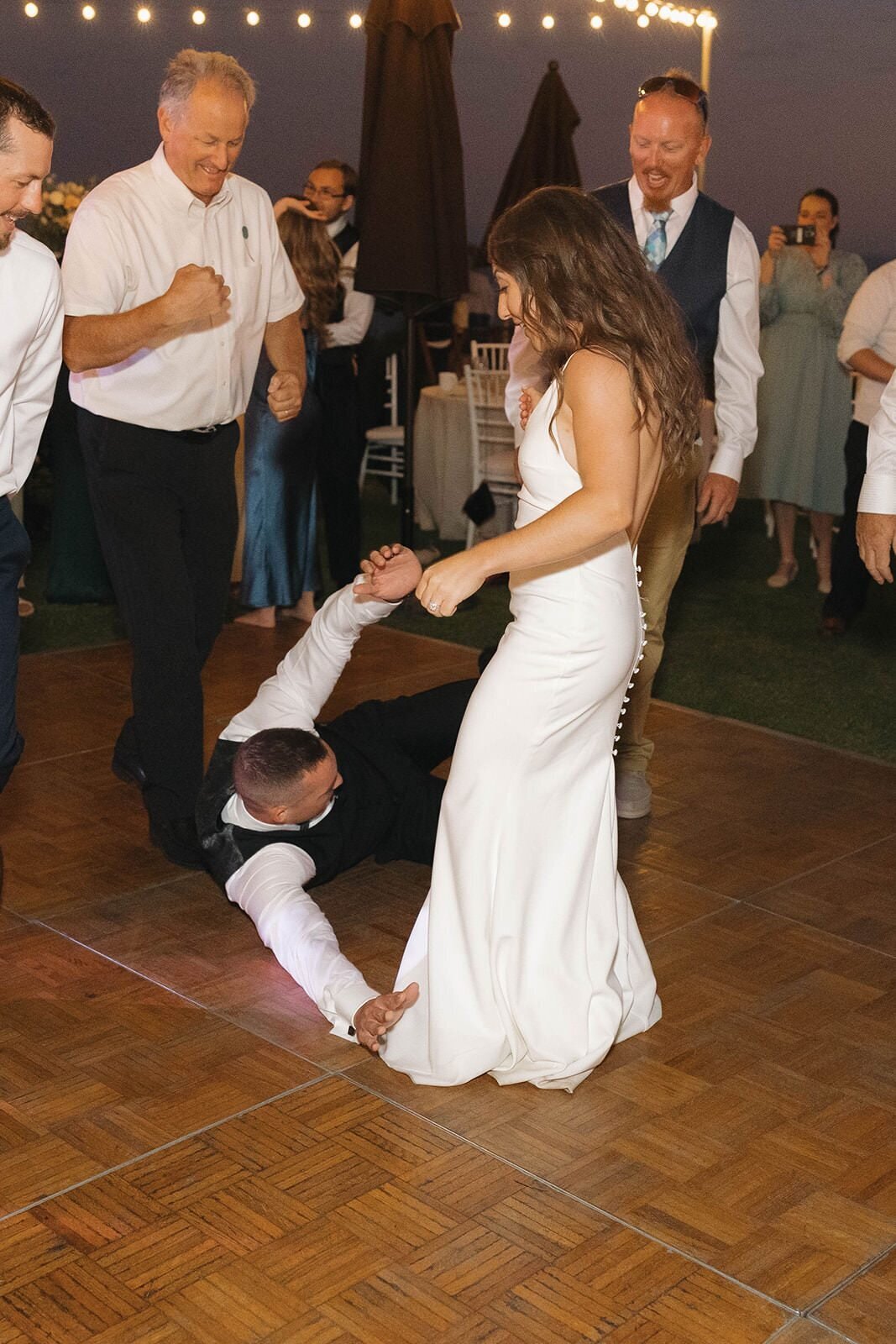 Guests cheering on the bride on the dance floor