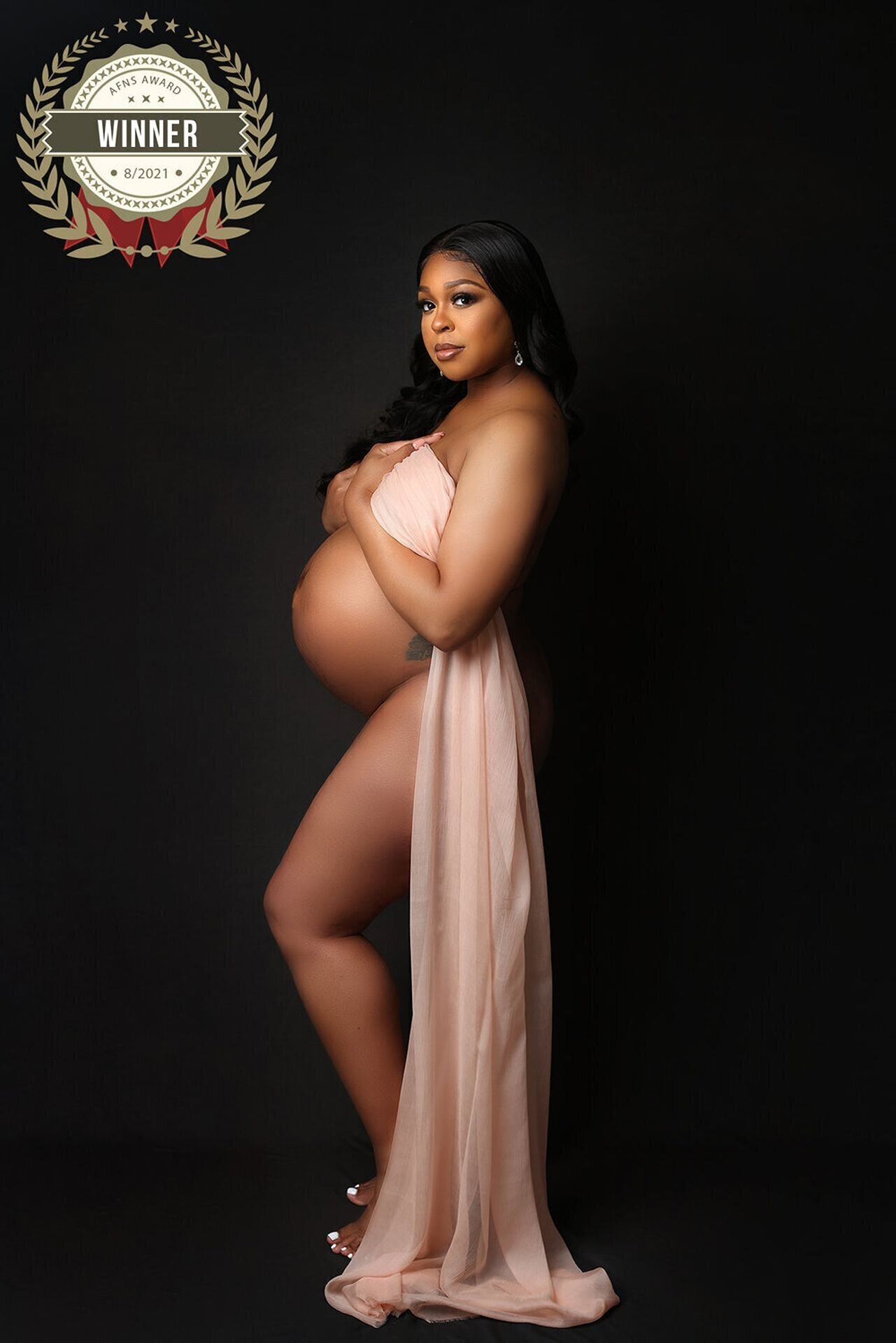 Pregnant woman in an elegant silk robe