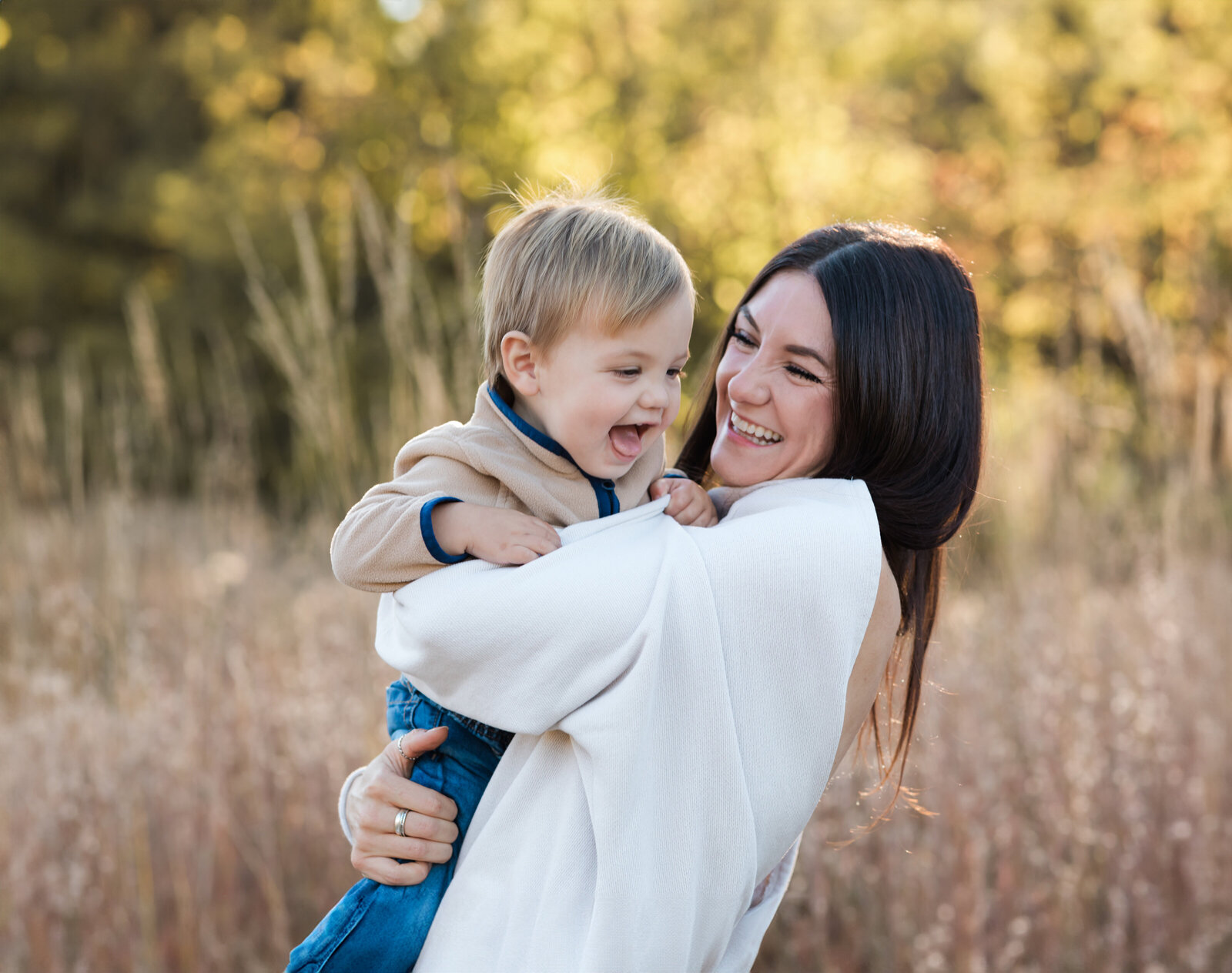 mom holding son laughing for family photos at westcreek reservation