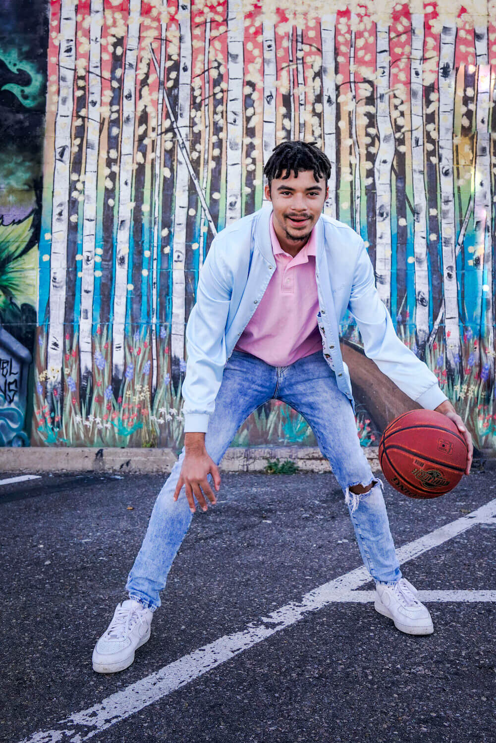 boy smiling with basketball