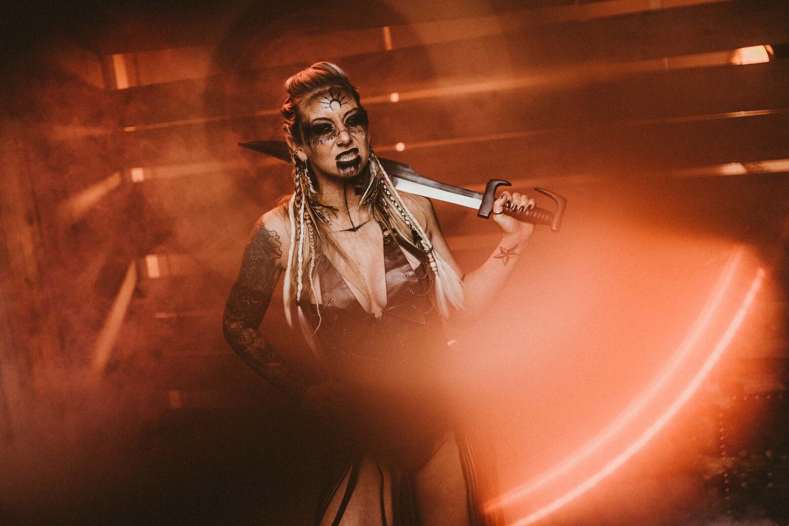 scary looking woman holding a machete
