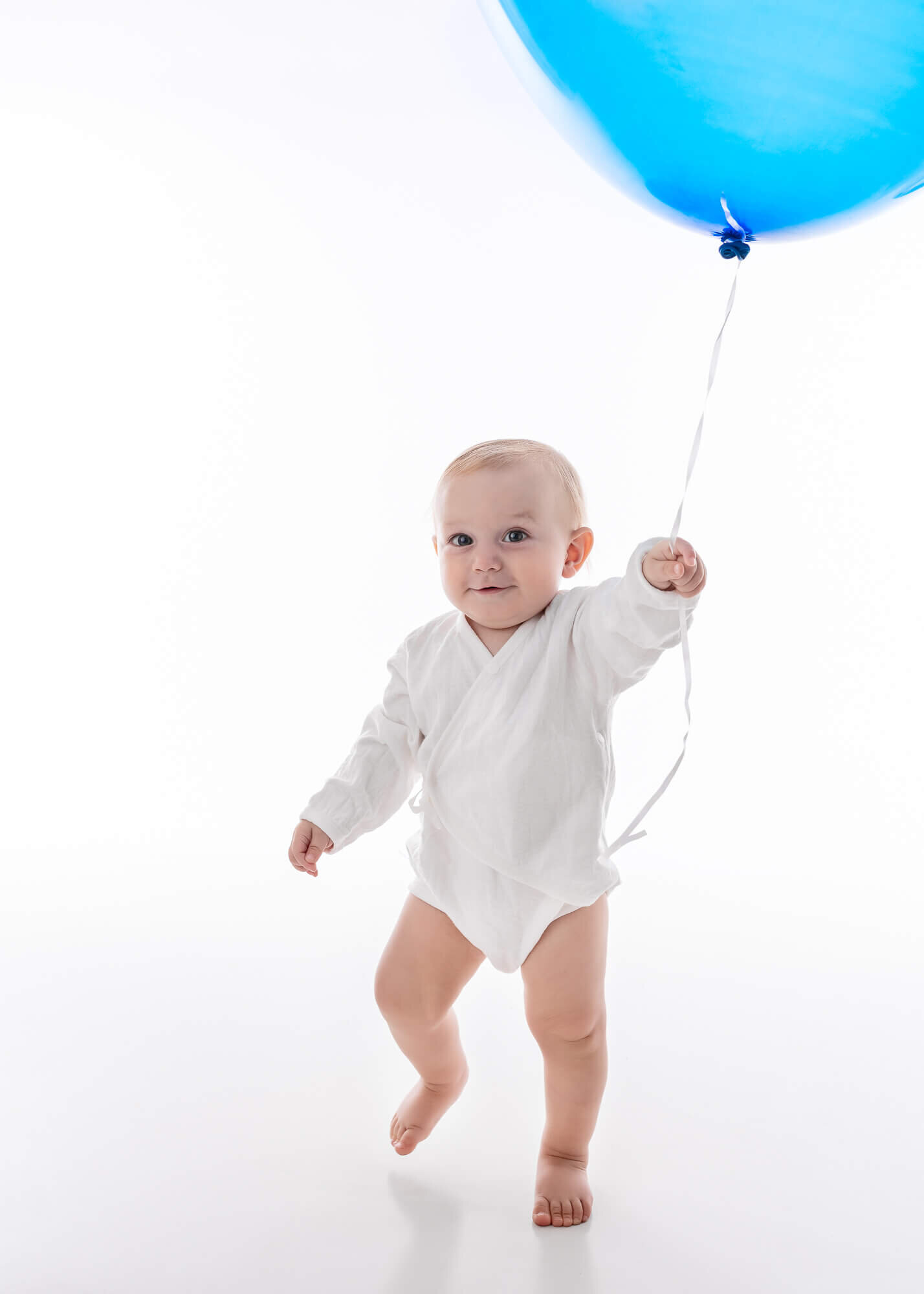 little boy holding his balloon