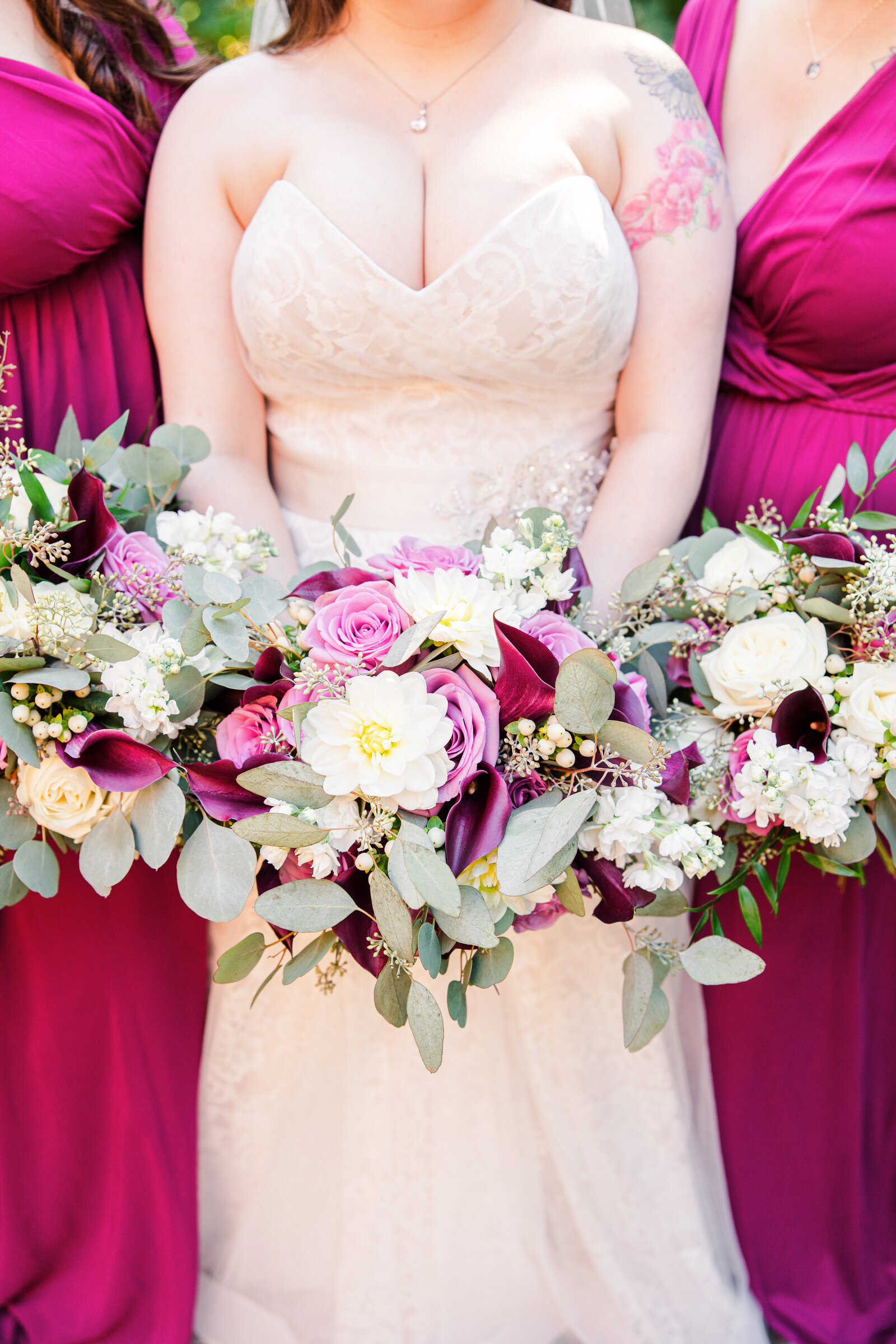 Bride and bridesmaids holding flowers