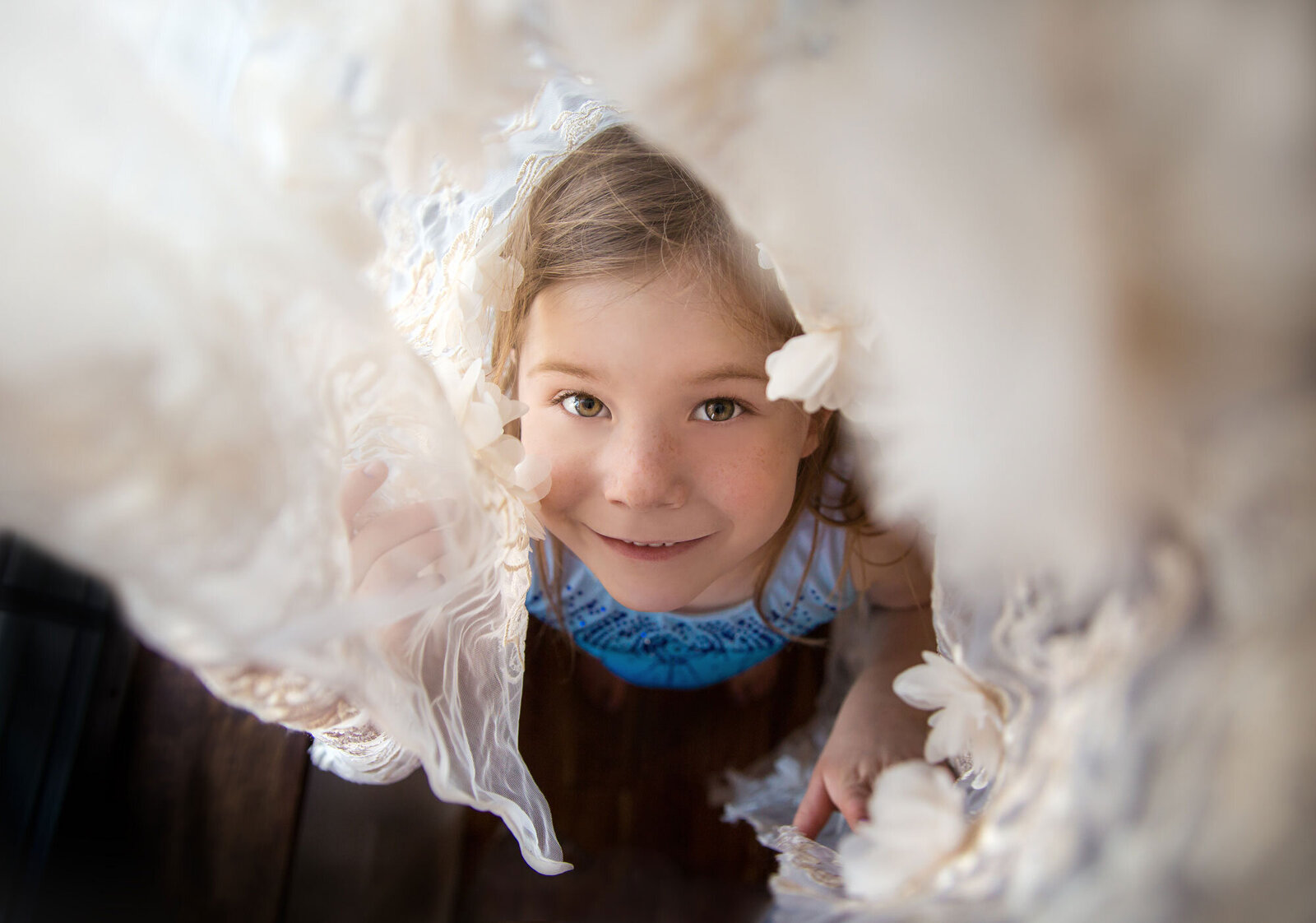 little-girl-looking-up-through-lace-curtain-cute-sweet