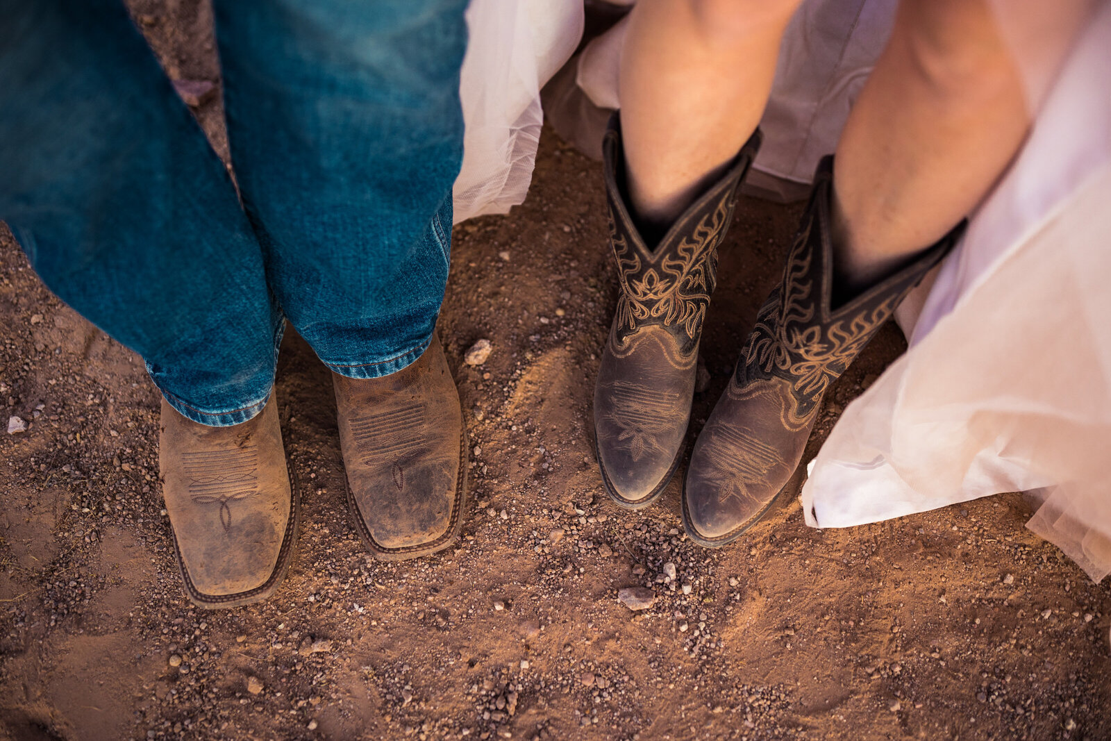 bride and groom in cowboy boots