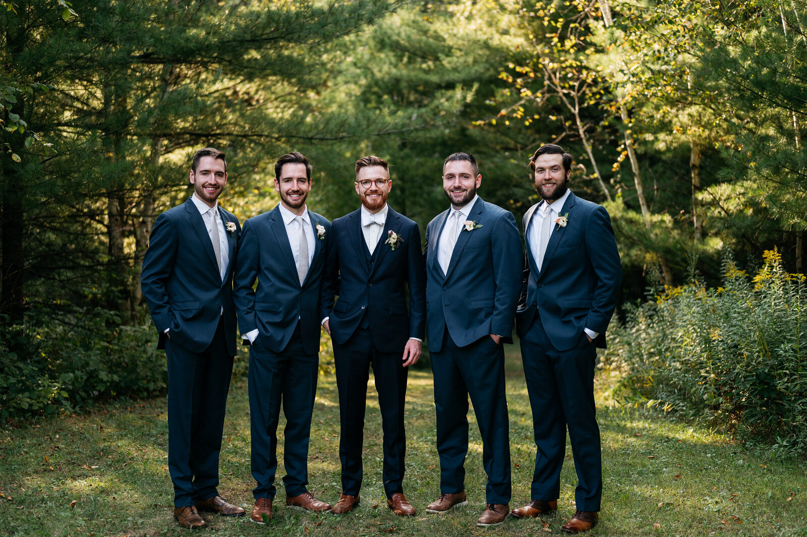 groom-groomsmen-outside-dark-blue