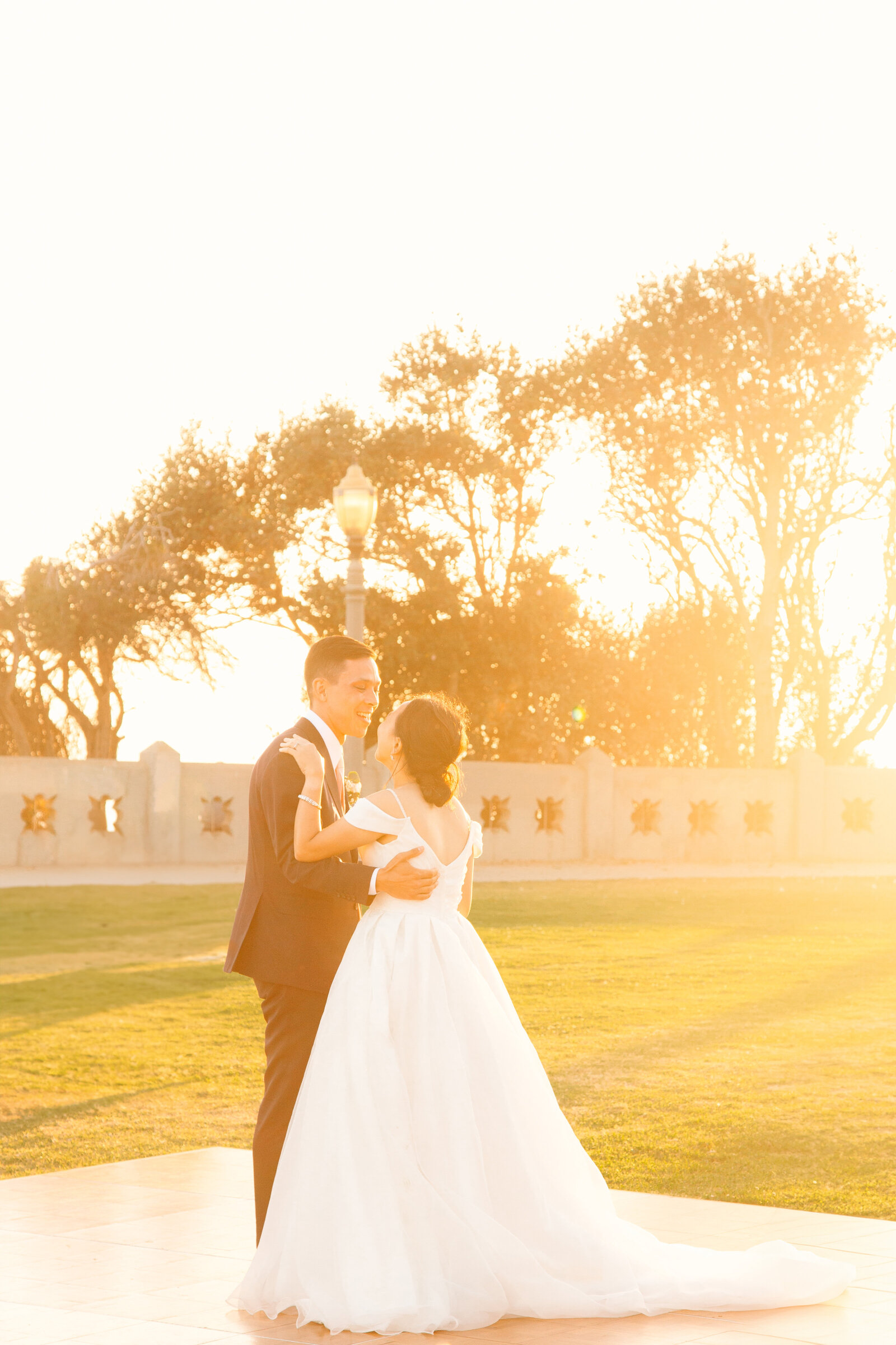 Newlyweds share their fist dance at their beach wedding in Los Angeles.