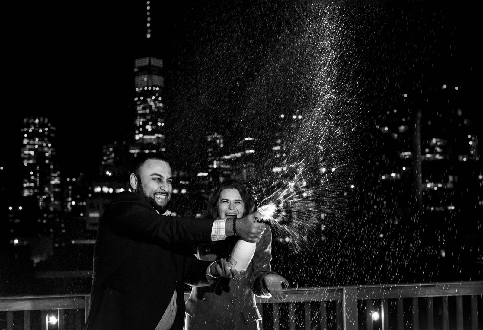 Arif + Roza - ny-proposal-with-champagne-spray