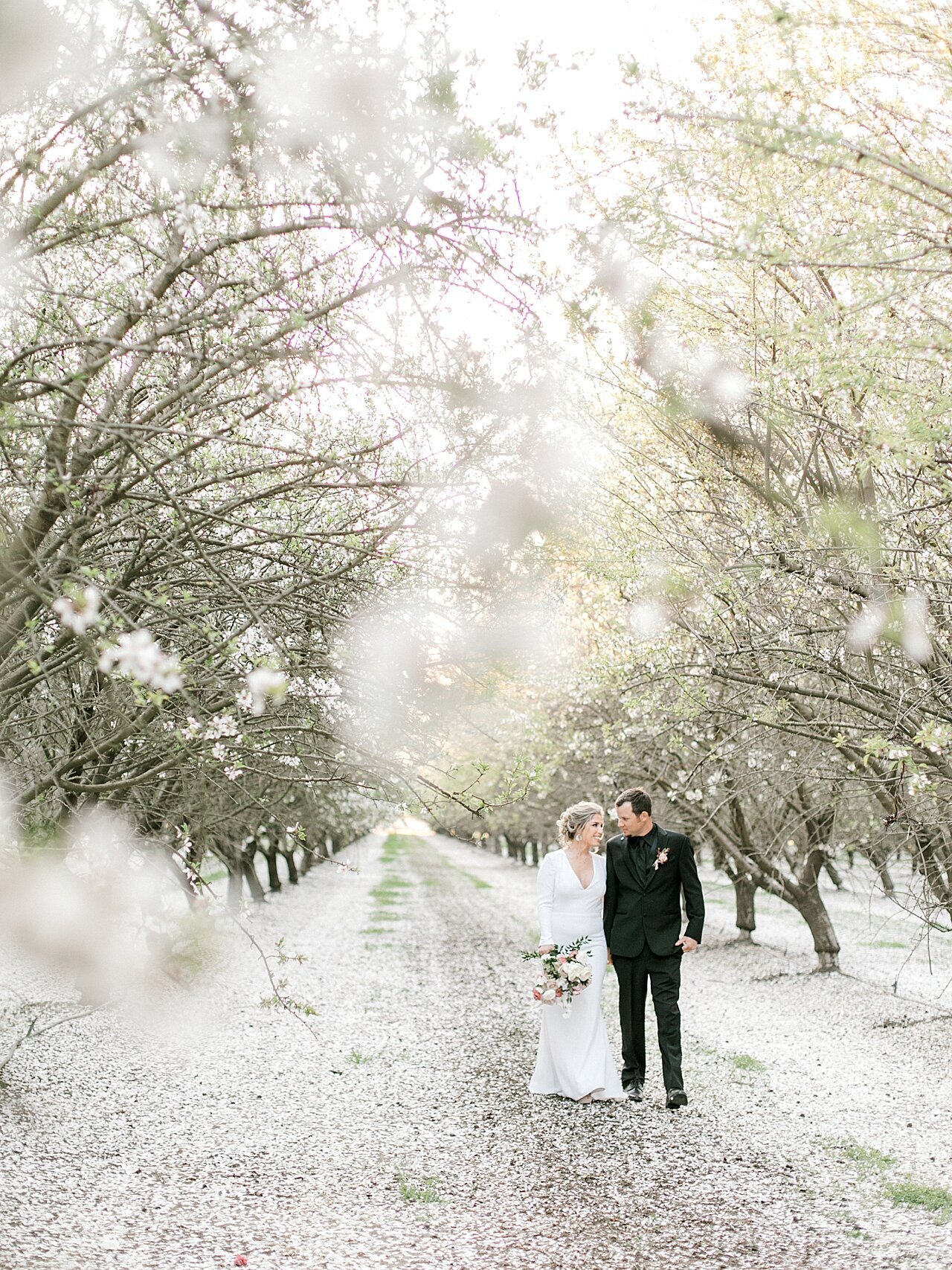 Emerald grace floral design wedding with Lauren Westra photography almond orchard bride and groom soft blush color palette central california weddings_2500