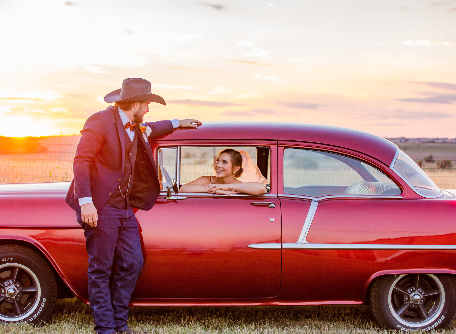 bride in classic car looking at groom