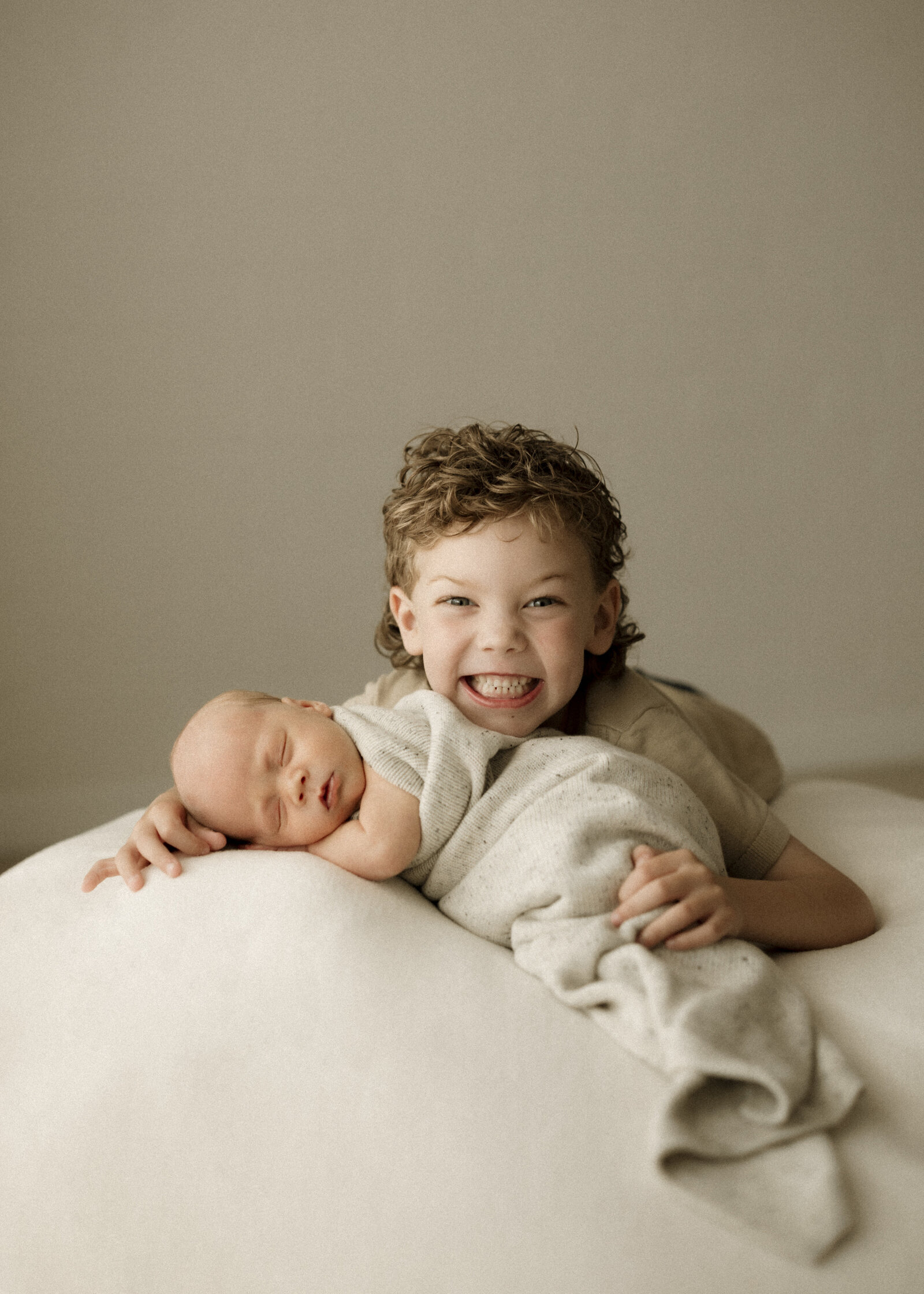 Classic newborn family portraits in Perth – simple, elegant, and focused on the connection between parents and baby.