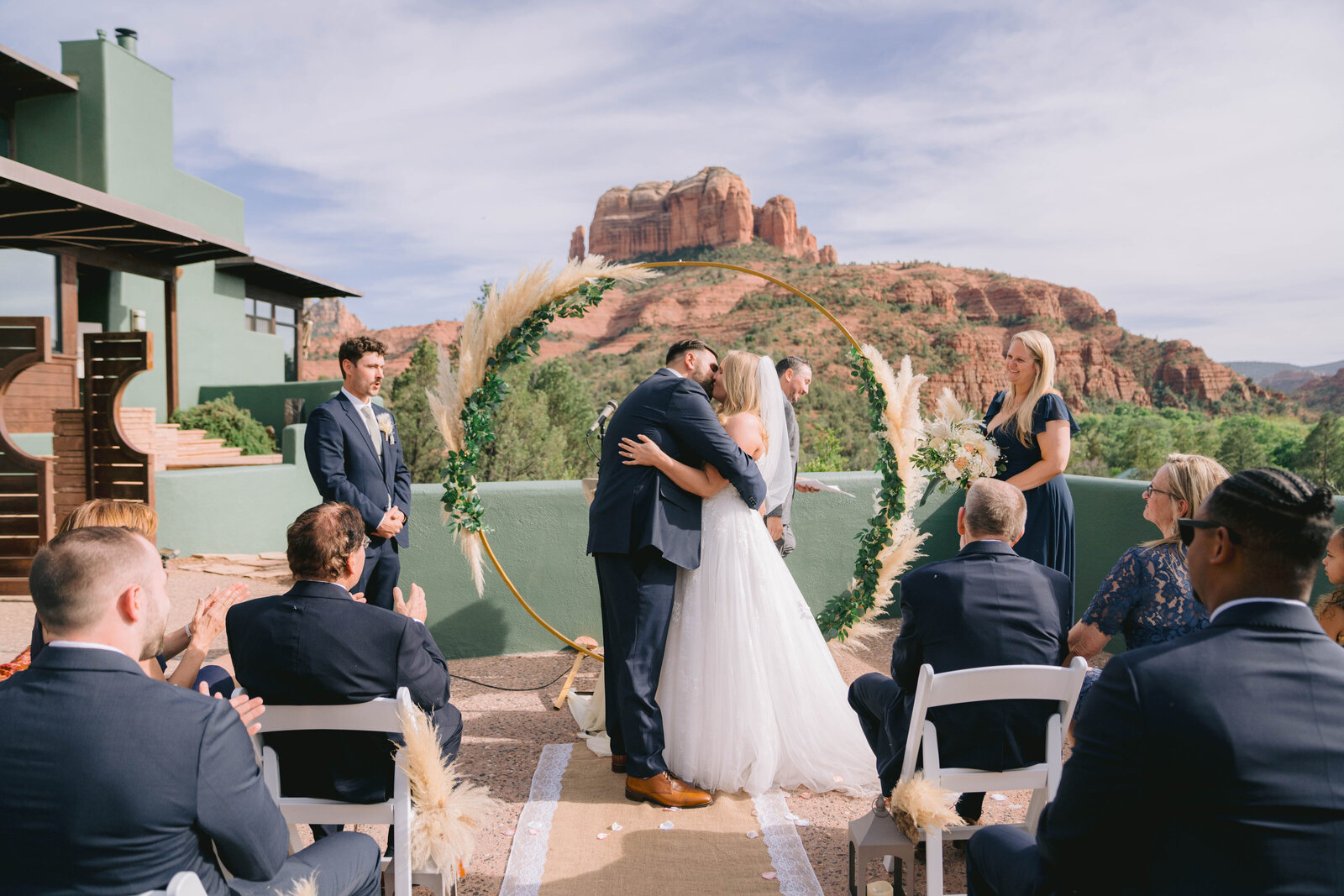 nate and kim kissing at altar