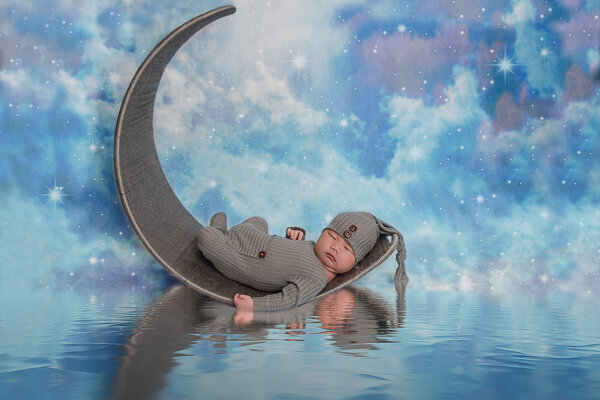 East Brunswick NJ Newborn Photographer Baby in moon crescent water reflection
