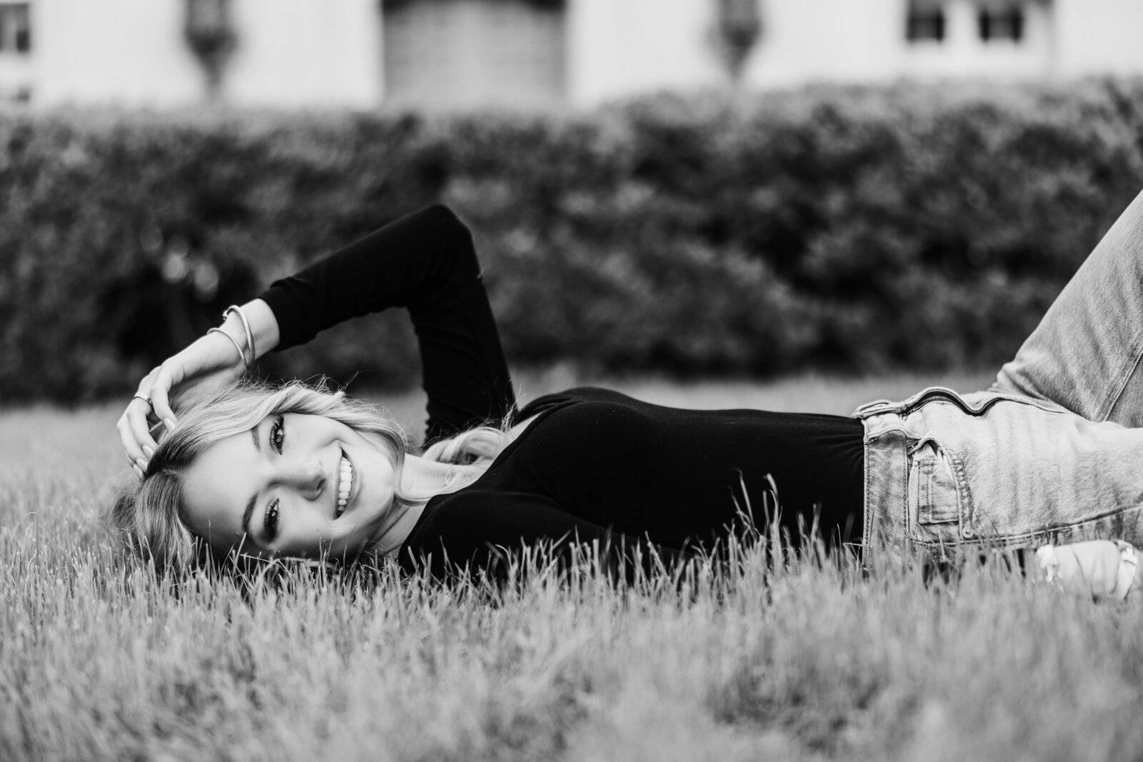 high-school-senior-lays-in-grass