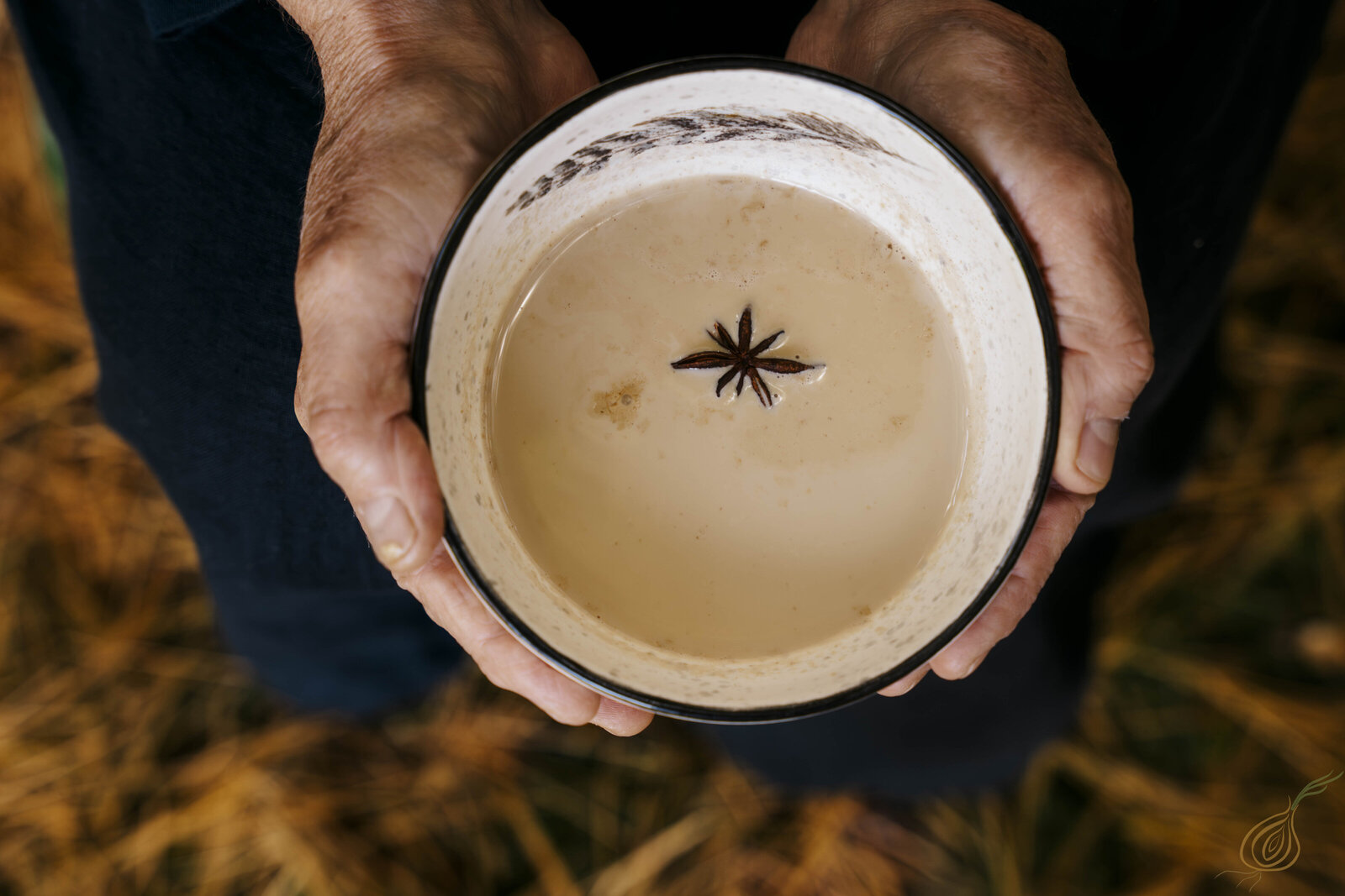 A person presents a cup of tea, highlighting the essence of comfort in everyday life.