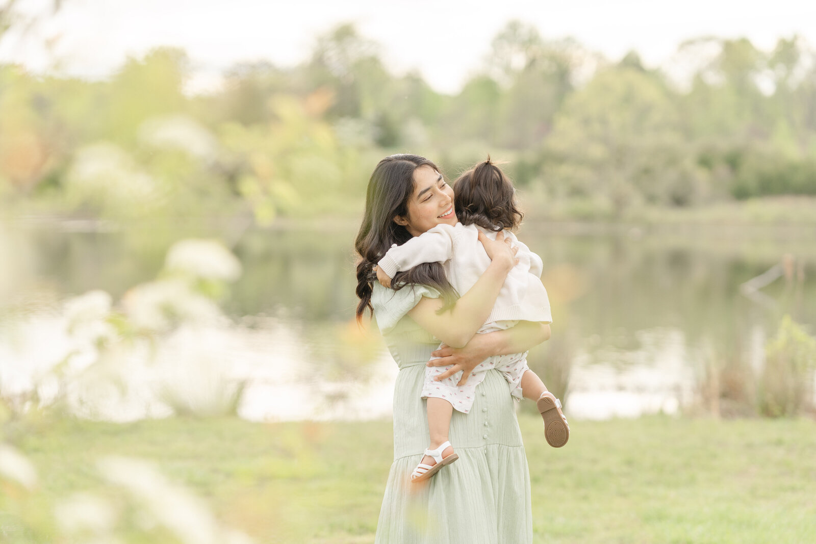 mom hugs daughter during spring mini session in Haymarket, Virginia