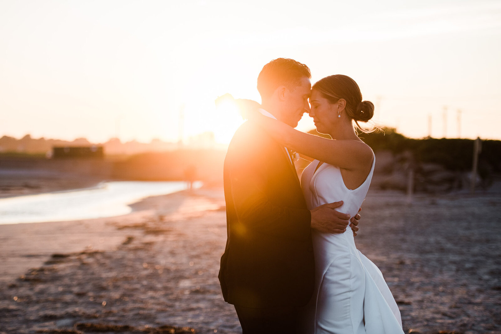 romantic embrace at sunset