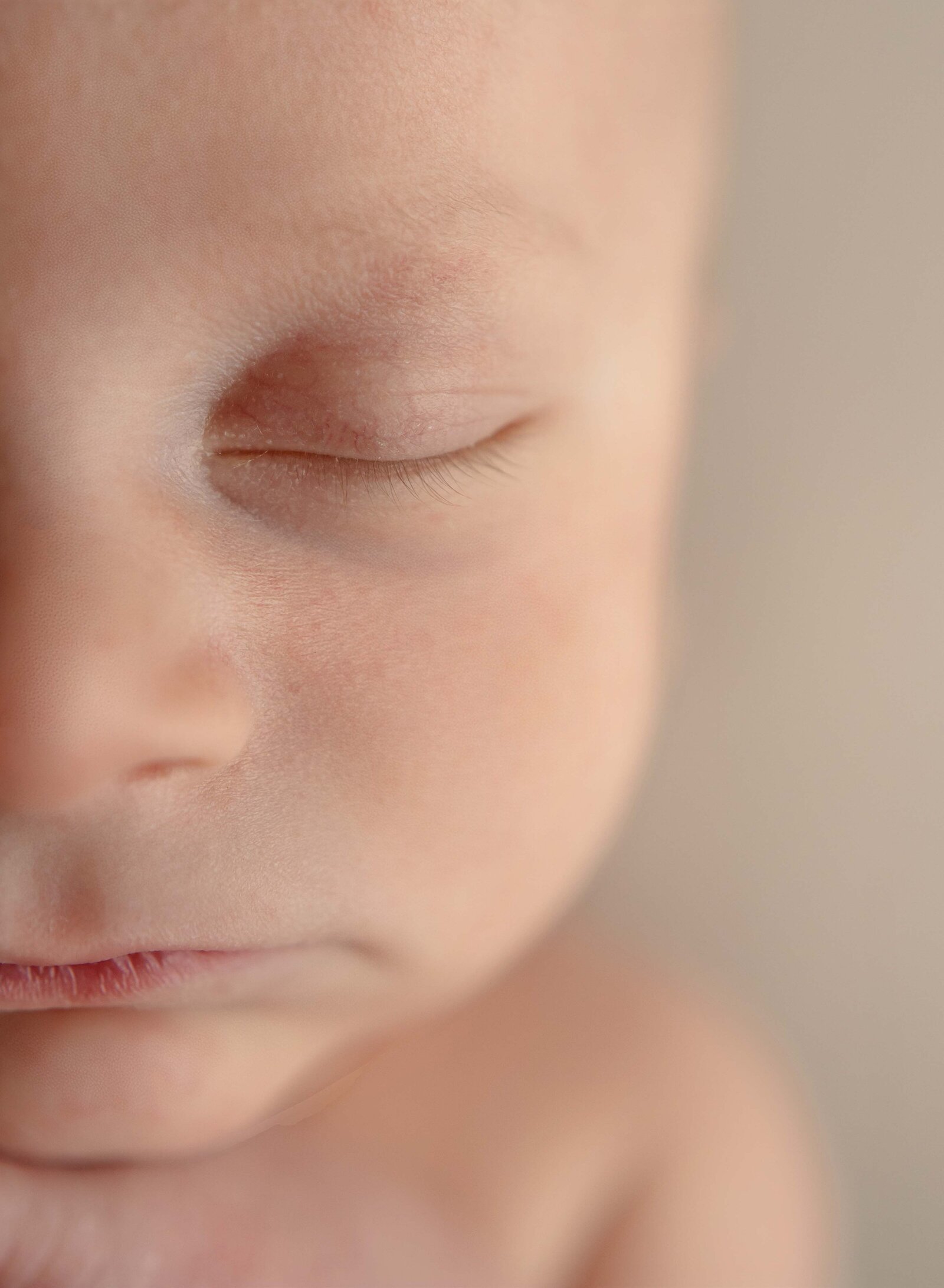 Macro newborn photo of baby boy's eyelashes. Photo taken at Marietta Newborn photo studio in Woodstock, GA.