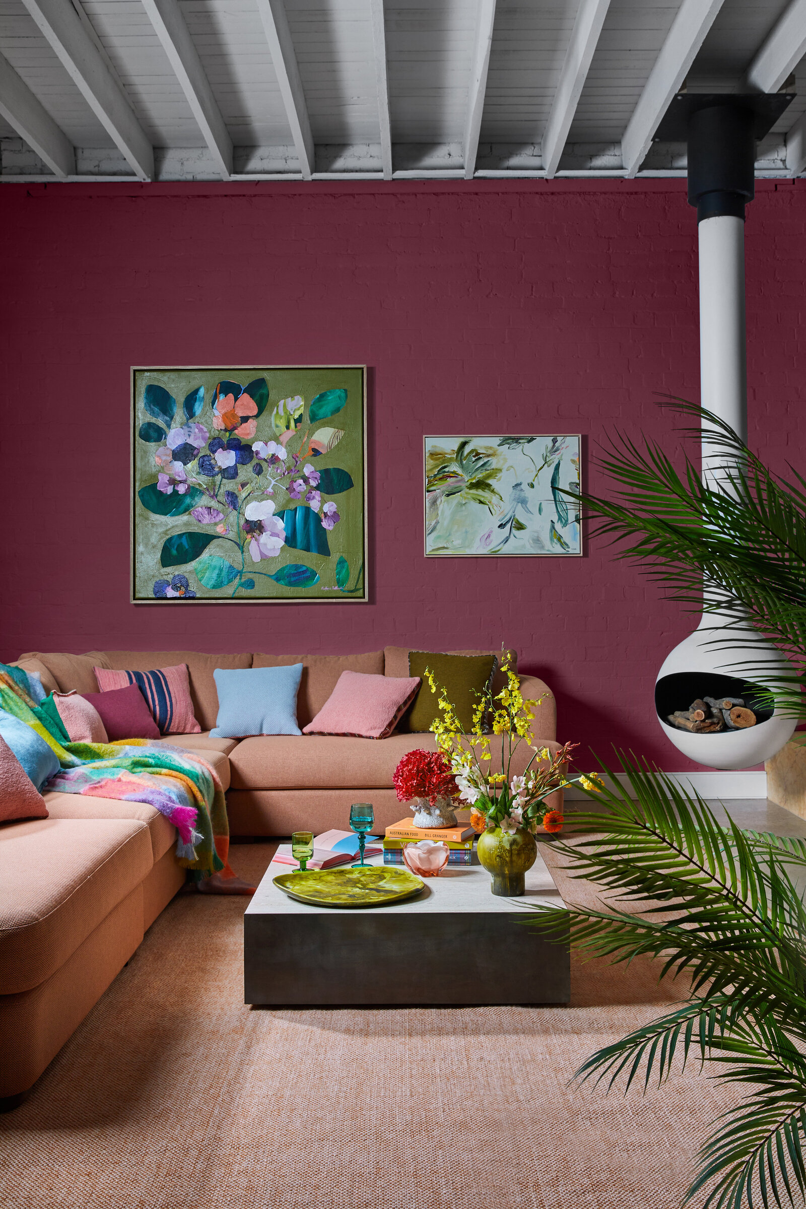 pink couch and rug with decorated coffee table