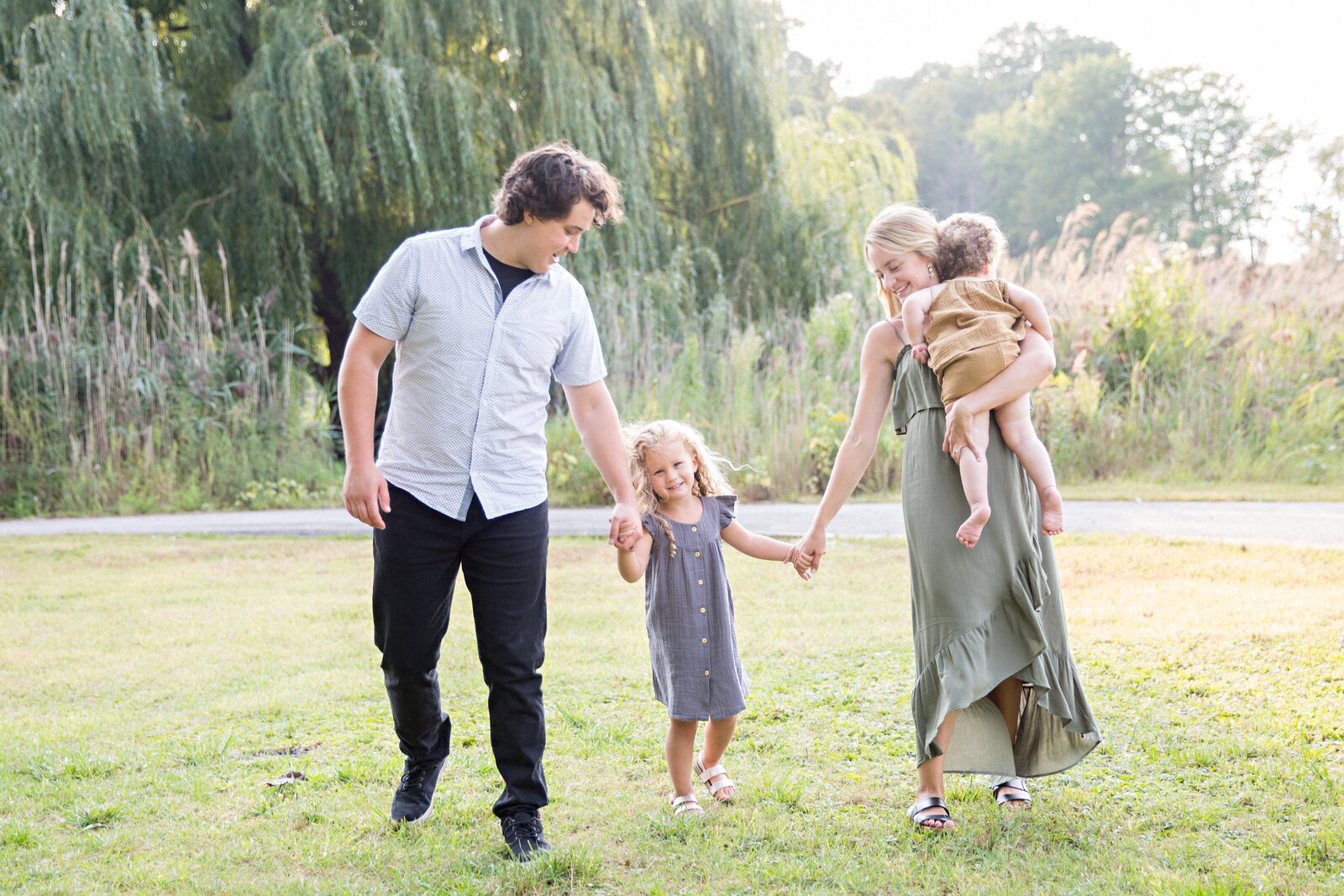 family walking on grass