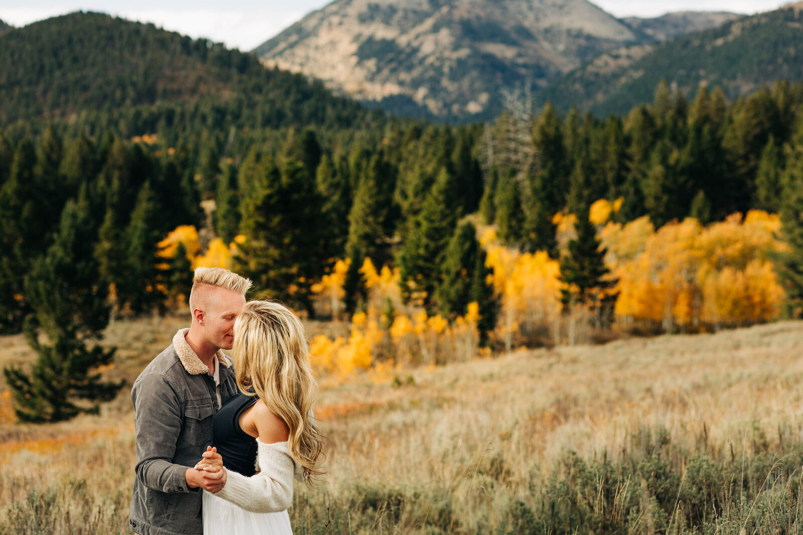 Capture the magic of your special day amidst the breathtaking beauty of Yellowstone National Park in the fall with our enchanting wedding photo collection. Immerse yourselves in nature's vibrant palette as golden leaves frame your love story against the backdrop of iconic geysers and majestic landscapes. Let the timeless charm of autumn in Yellowstone create unforgettable memories for your happily ever after