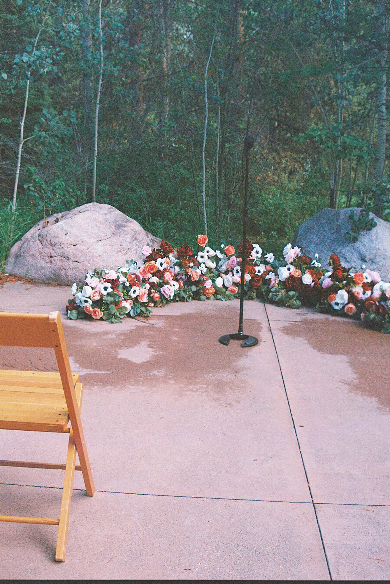 Elegant wedding ceremony site with floral backdrop