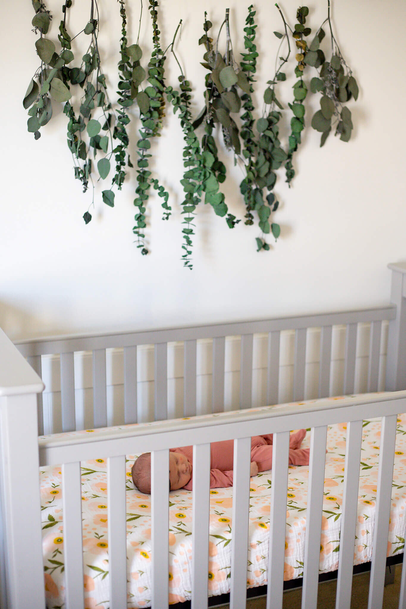 A Northern Virginia newborn girl laying in her crib.