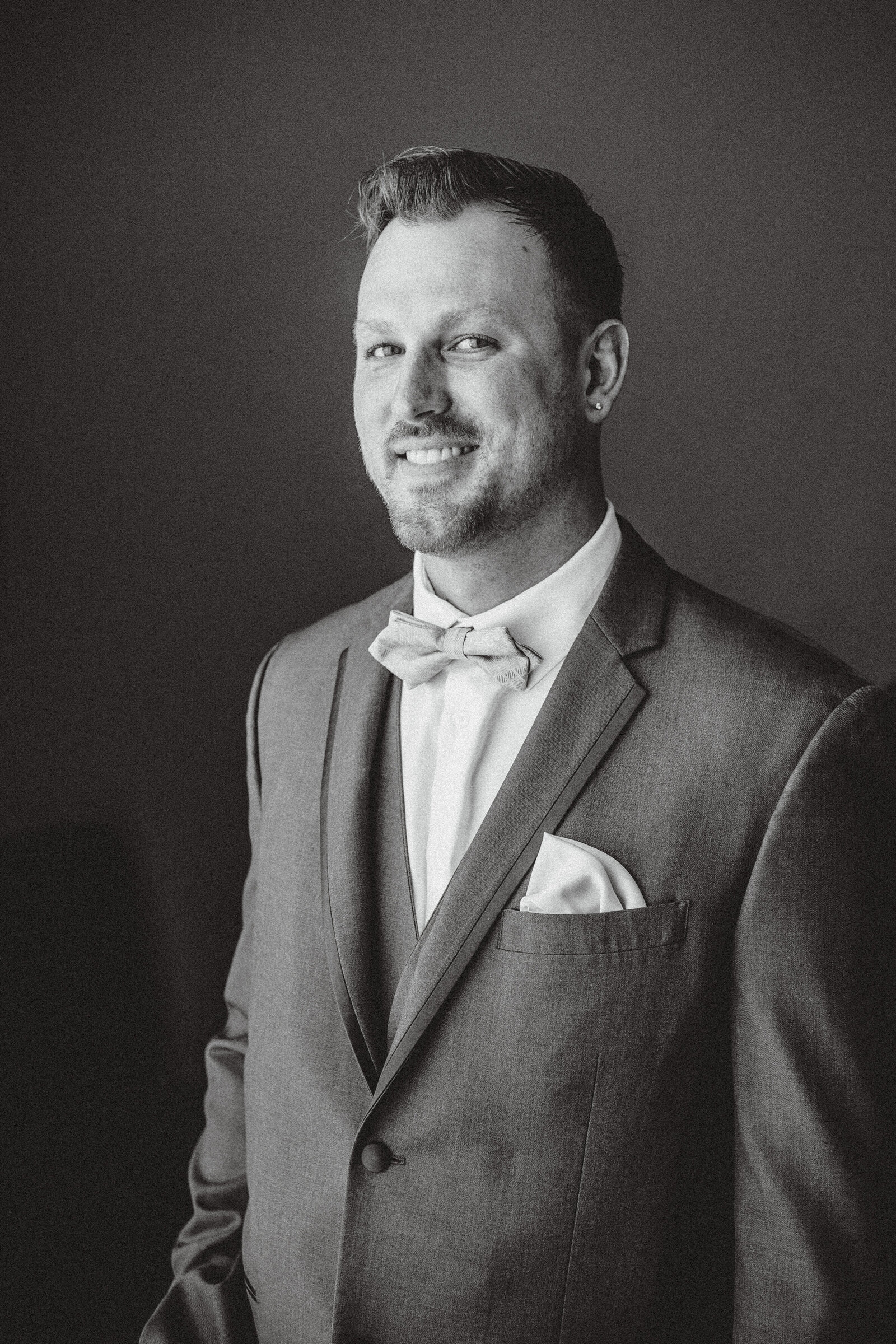 Black and white photo of  groom portrait