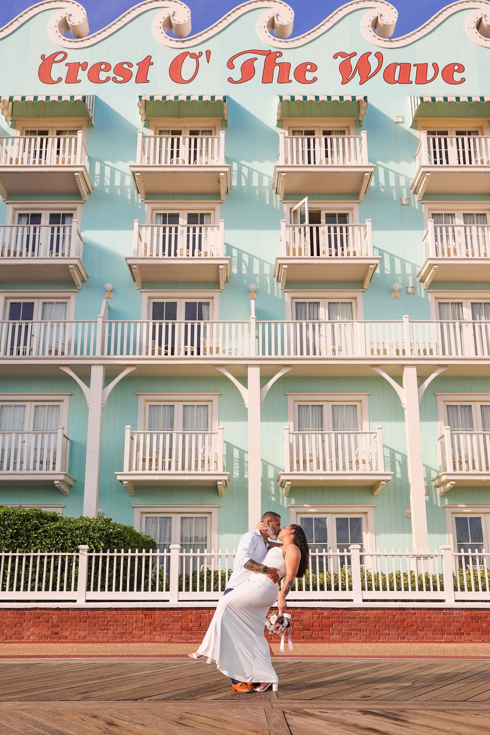 Bride and Groom kissing after elopement at Disney Boardwalk in Orlando Florida by Amanda Richardson Photography