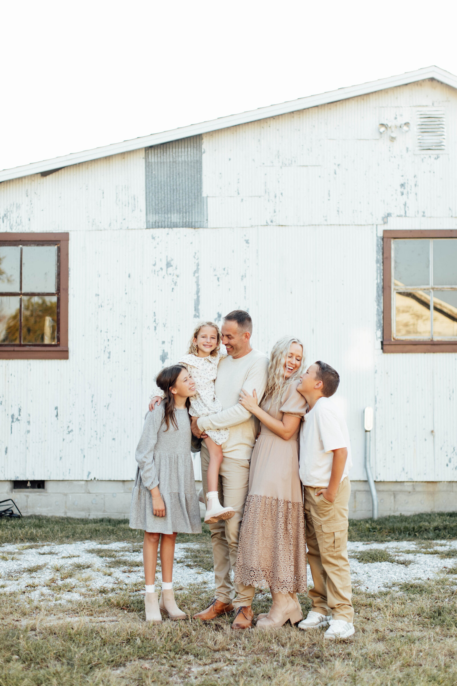 Family embracing and having fun during photo shoot.