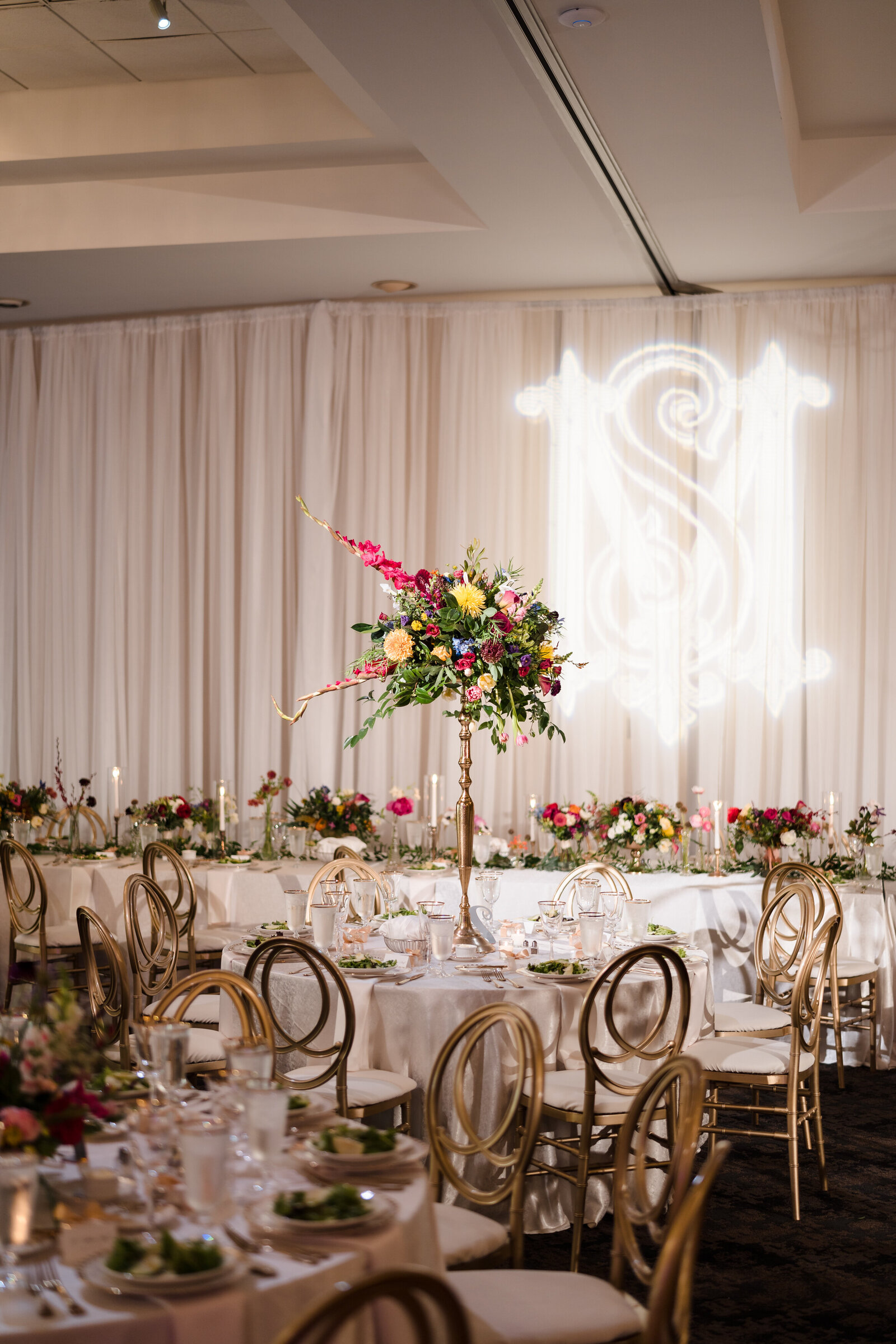 Photo of the reception space at Annunciation Cathedral featuring Dutch floral centerpieces