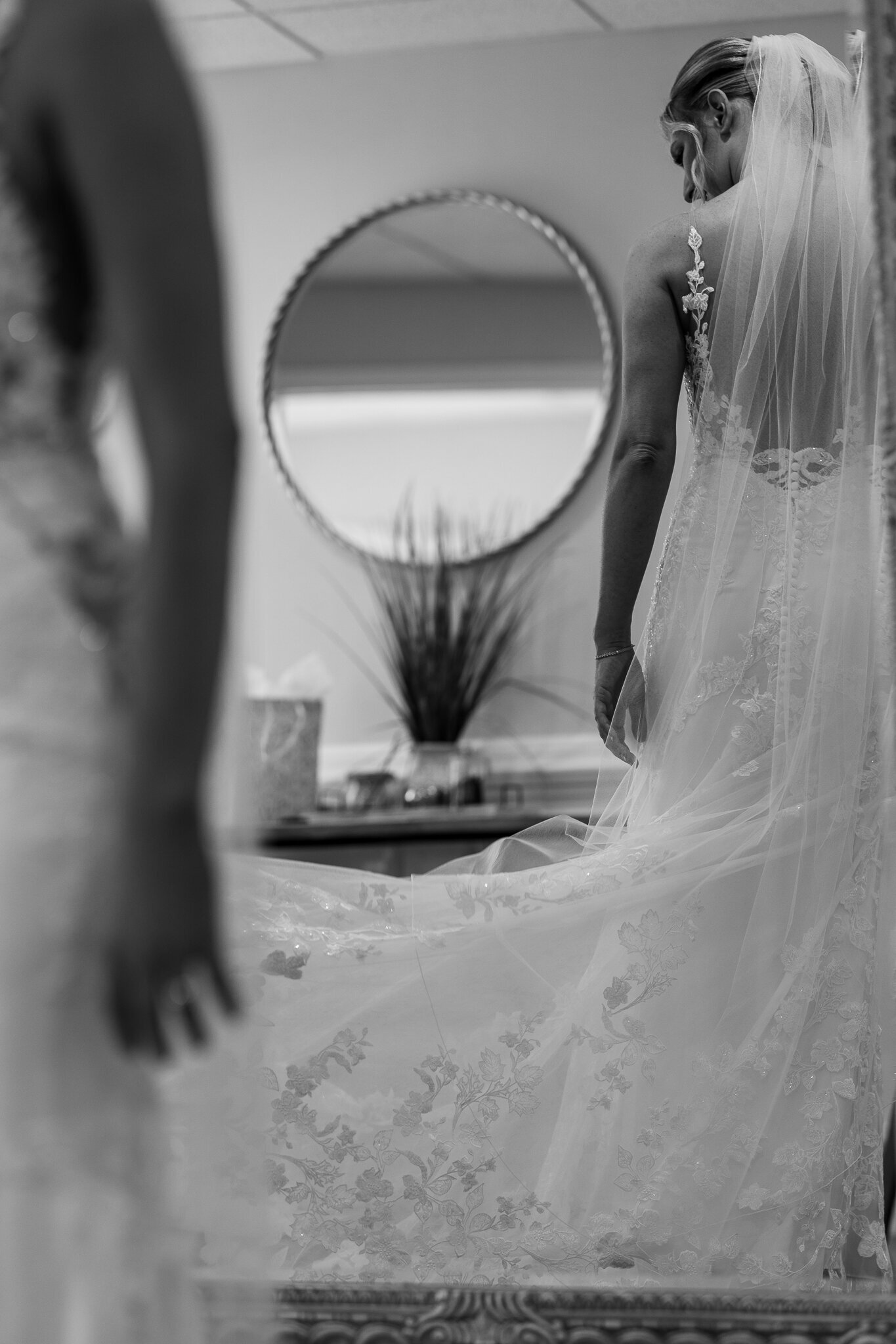 Bride’s reflection in the mirror while getting ready at SkyView Golf Club