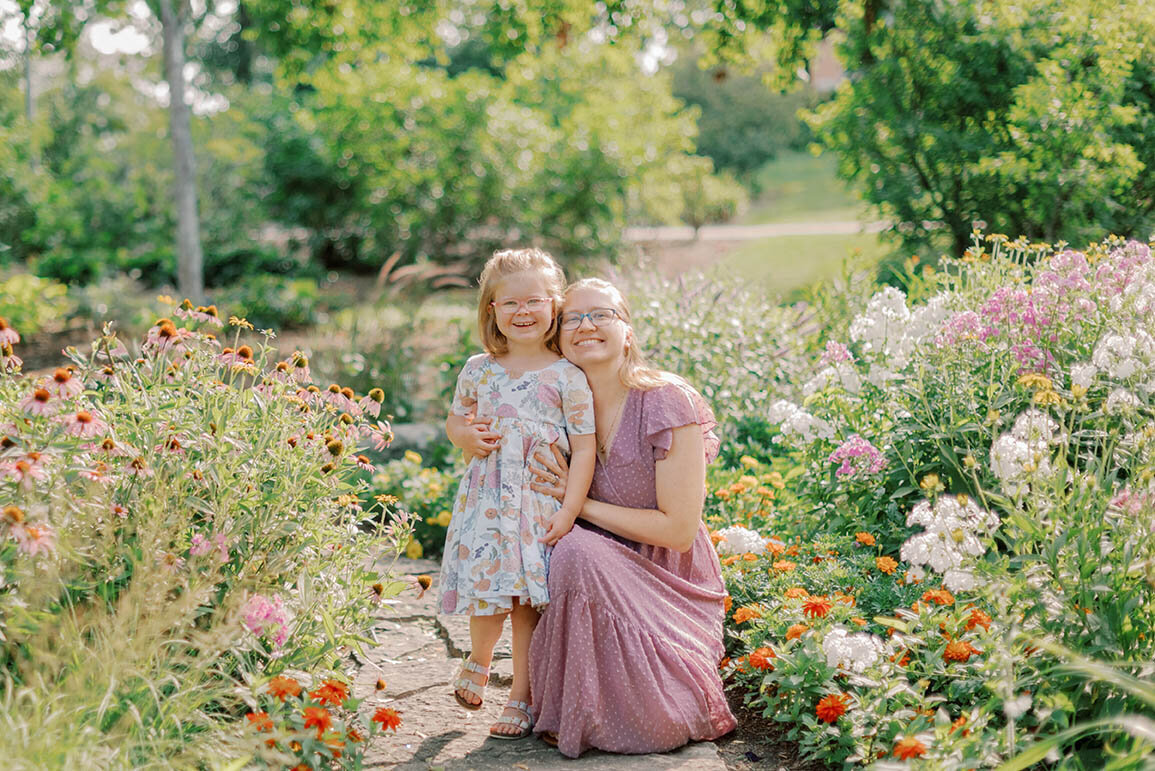 Mom and young daughter in a garden for their Chicago family photos