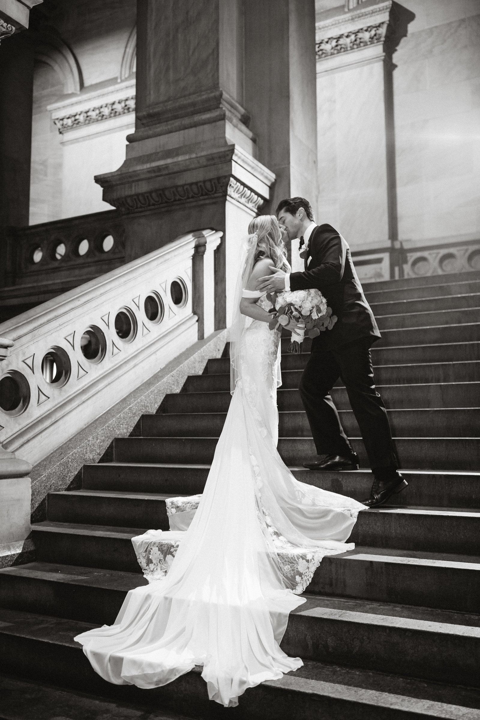 Dramatic portrait of the bride and groom at Philadelphia's City Hall.