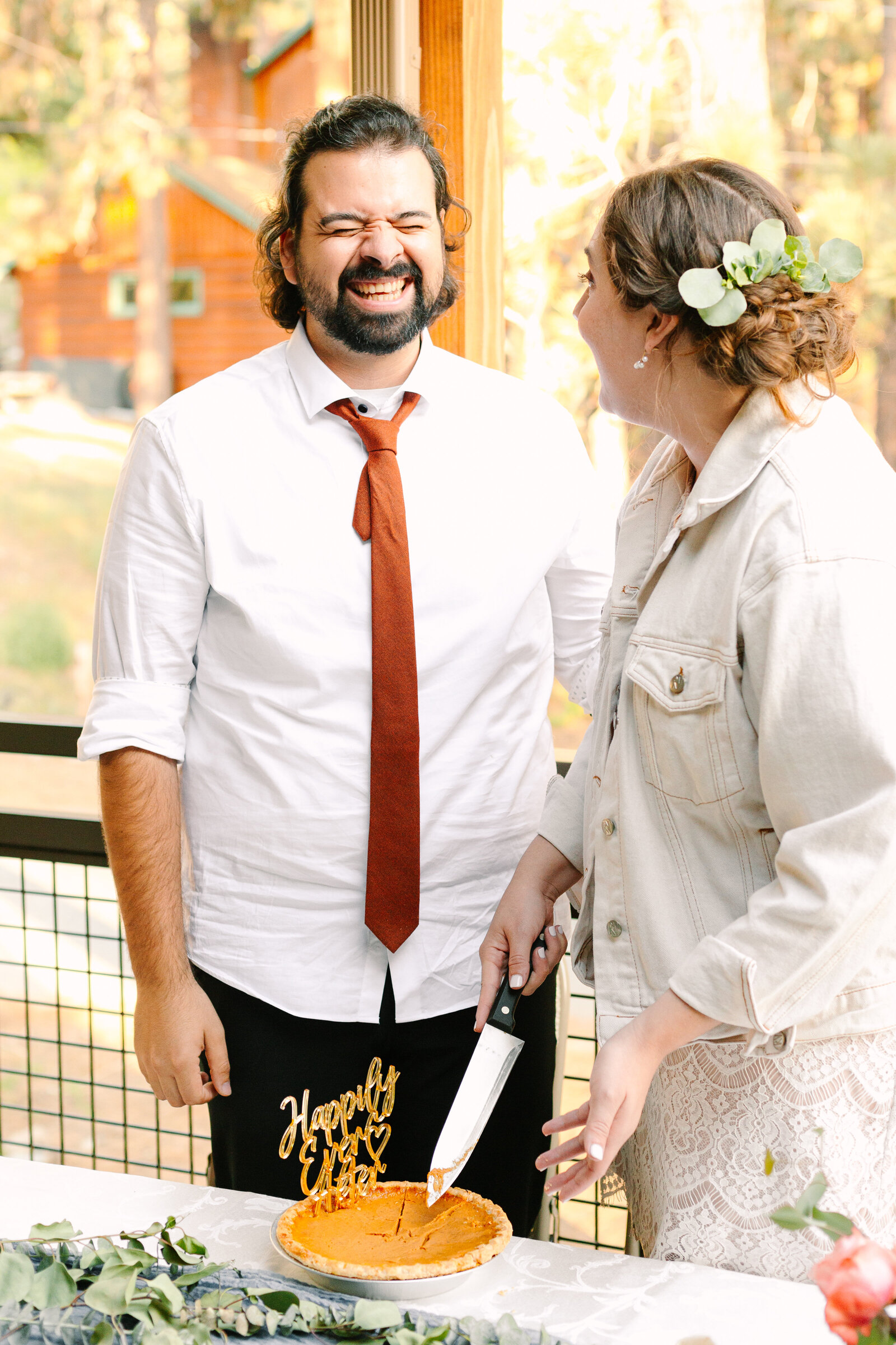 A couple celebrates their intimate elopement at a cabin at Big Bear Lake, California.