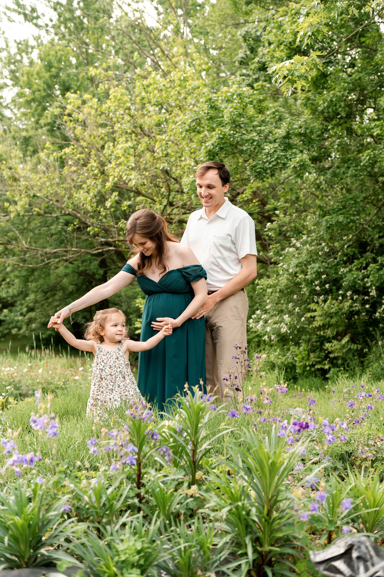 family in a flower field during a maternity session