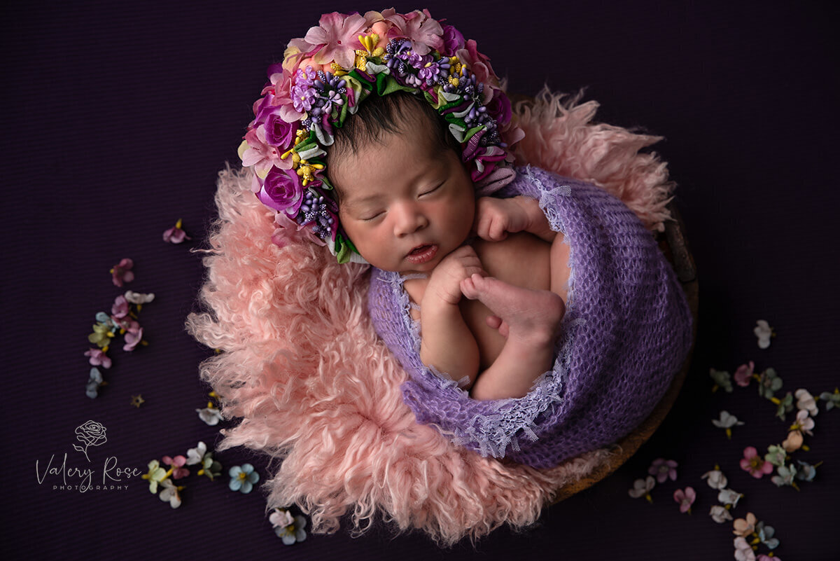 Baby girl wearing a flower bonnet