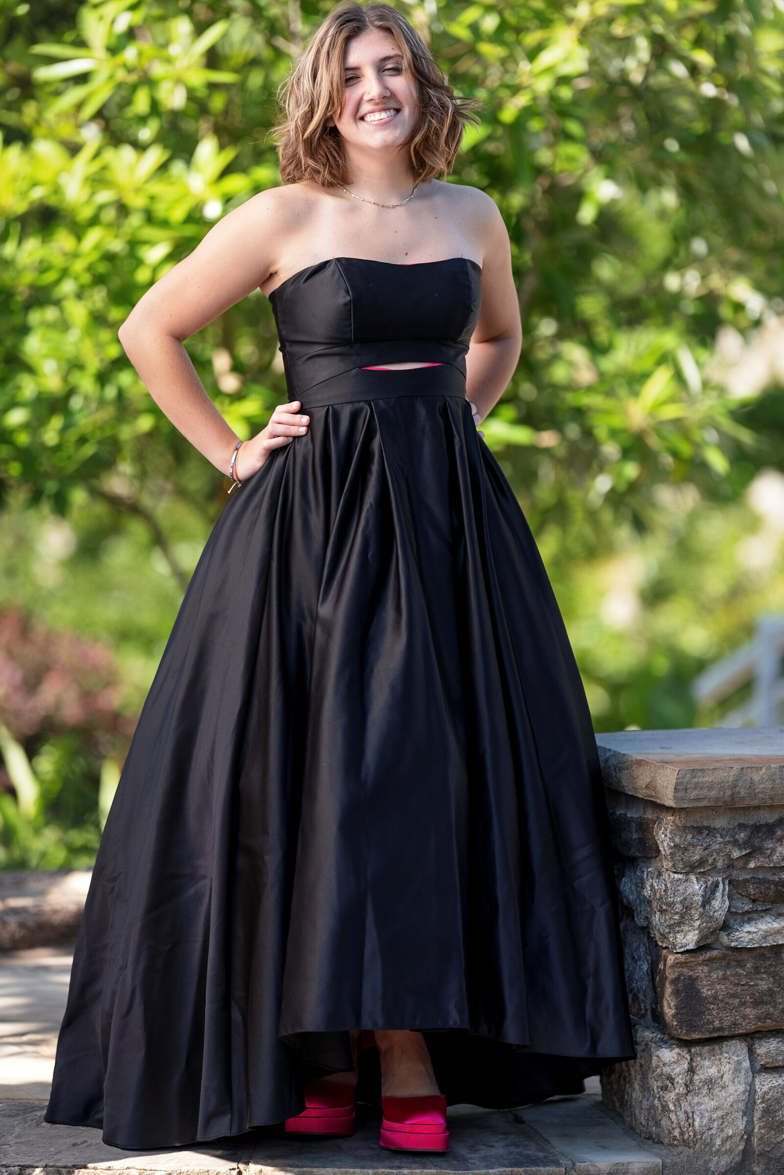 Girl outdoors is black dress