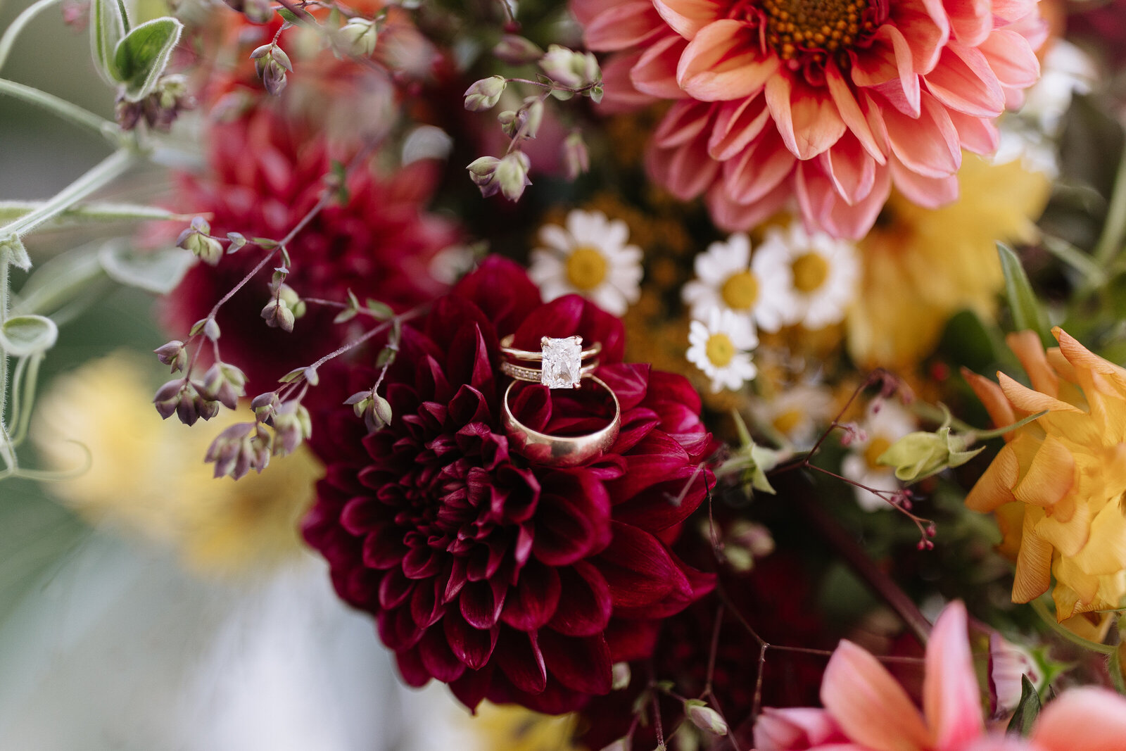 Bride's ring sitting in bouquet by window by best Northern California wedding photographers