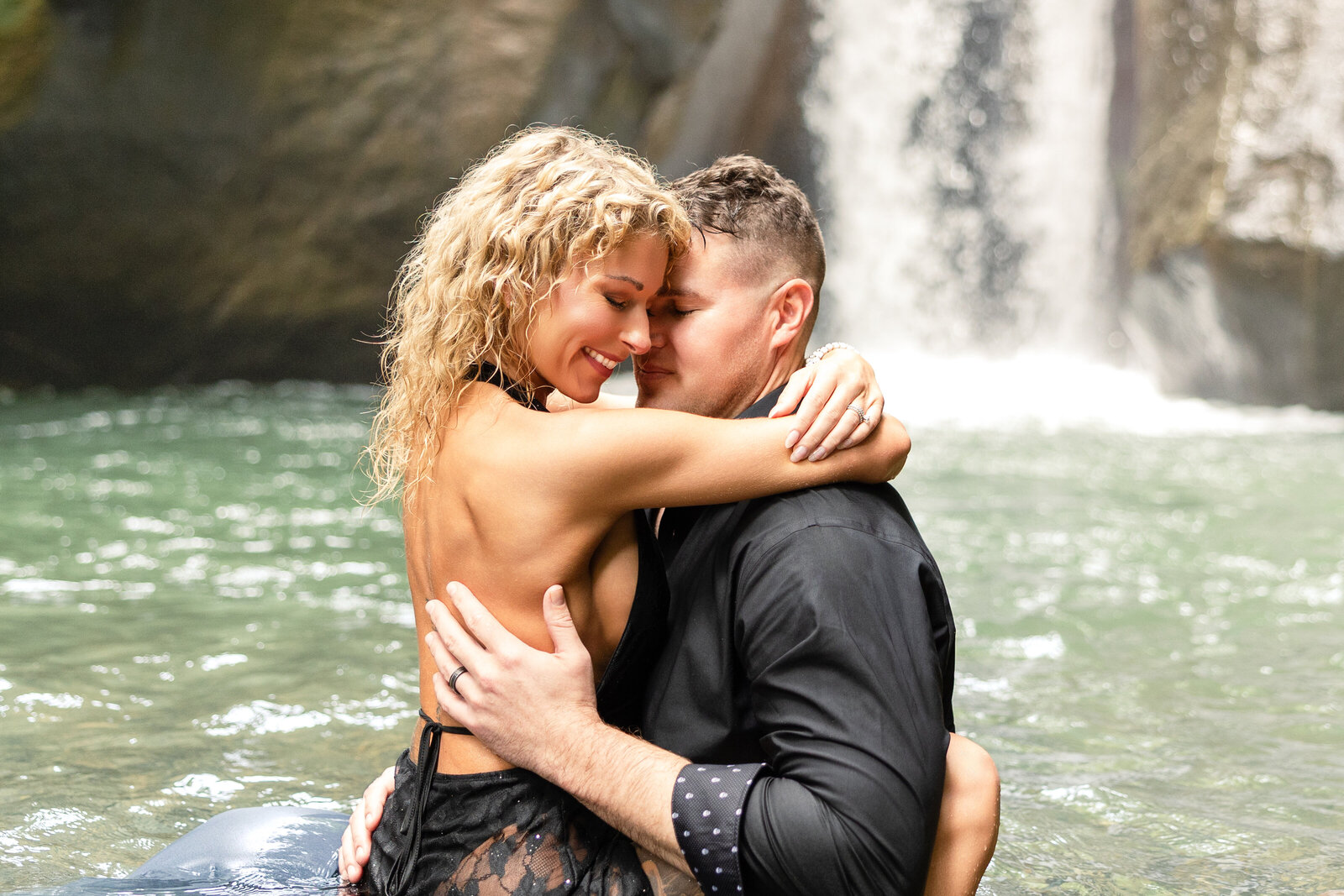 couples photography at a waterfall sensual couple embracing