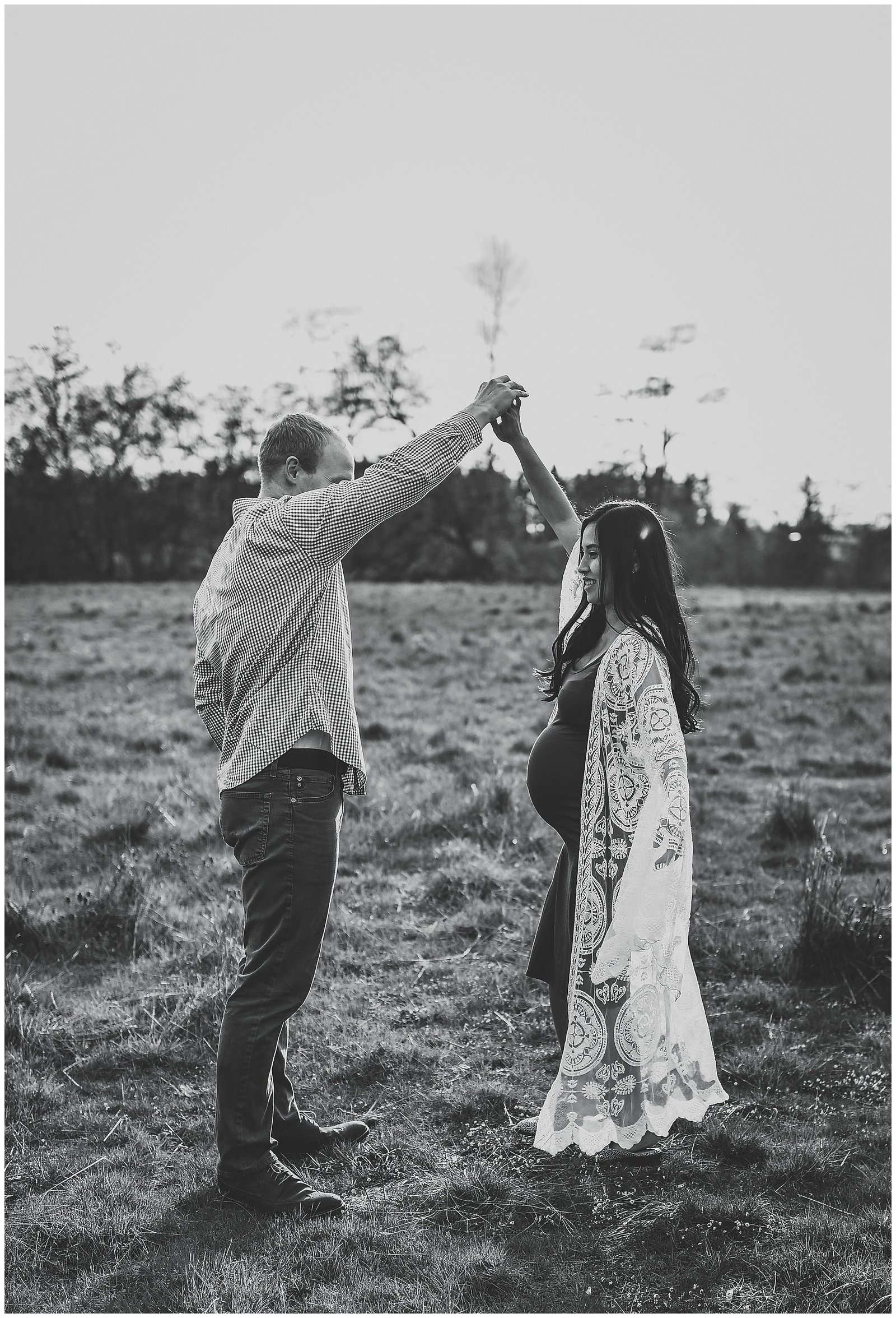 Black and white maternity photo session couple dancing in field Emily Ann Photography Seattle Photographer.