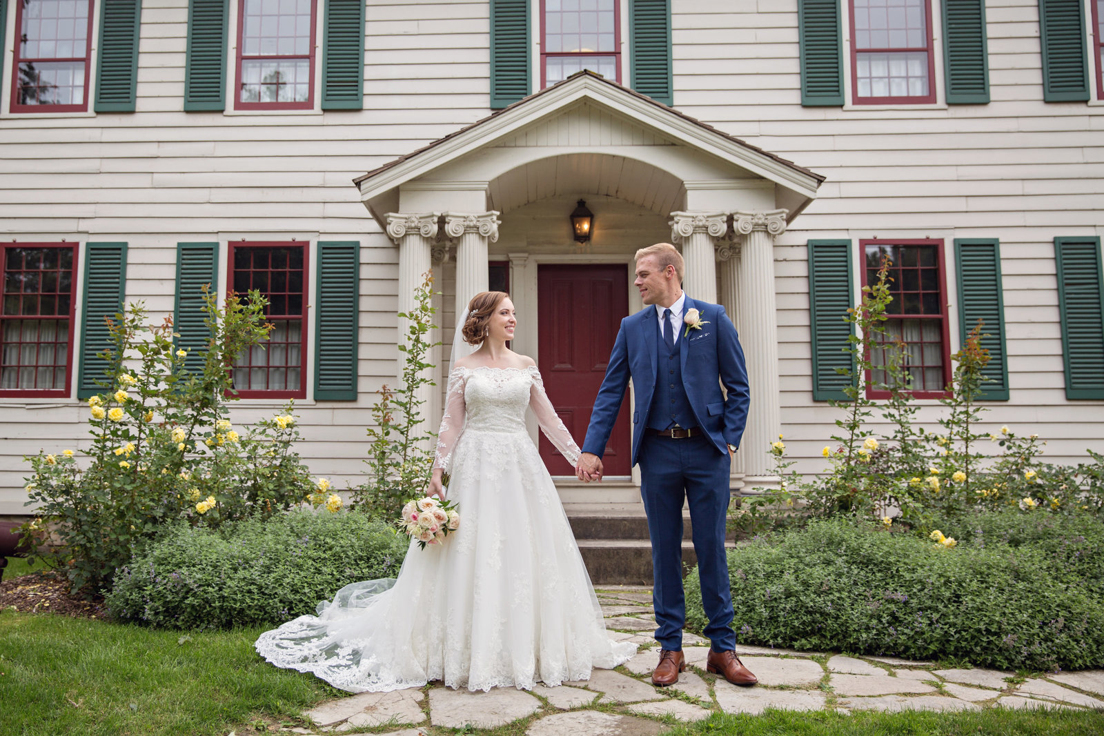 bride and groom holding hands at Battlefield Park Hamilton