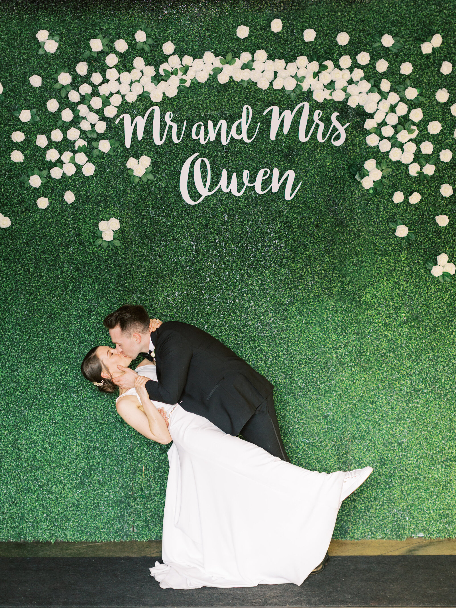 wedding photo backdrop  made of greenery and roses