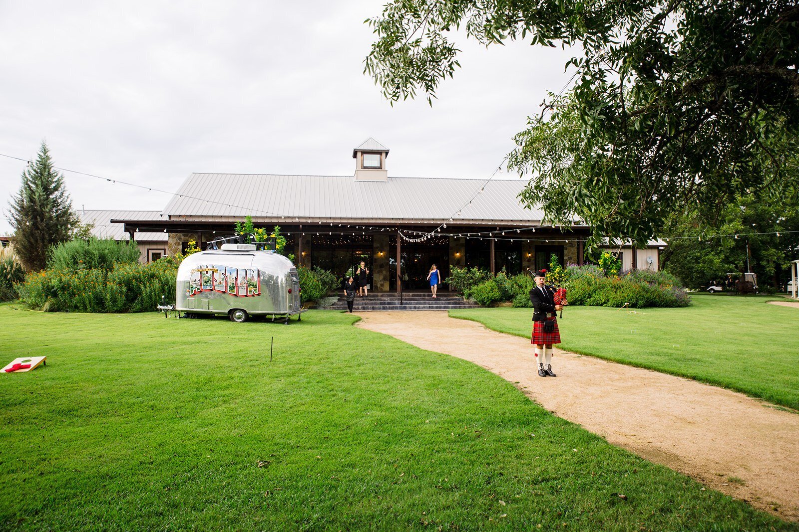 Bag piper outside hill country wedding reception venue