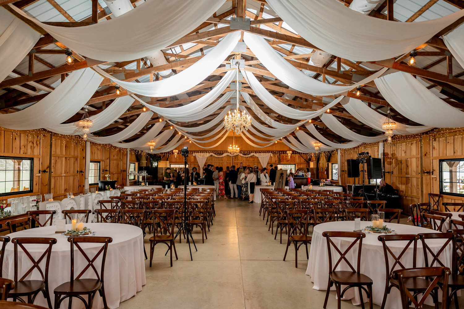 Indoor wedding reception setup with drapings